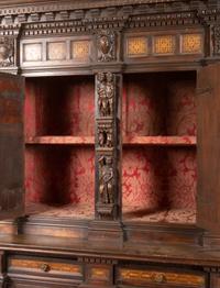 An Italian Baroque Style Carved Walnut and Marquetry Cabinet on Stand