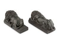 A Pair of Carved Green Marble Recumbent Lions