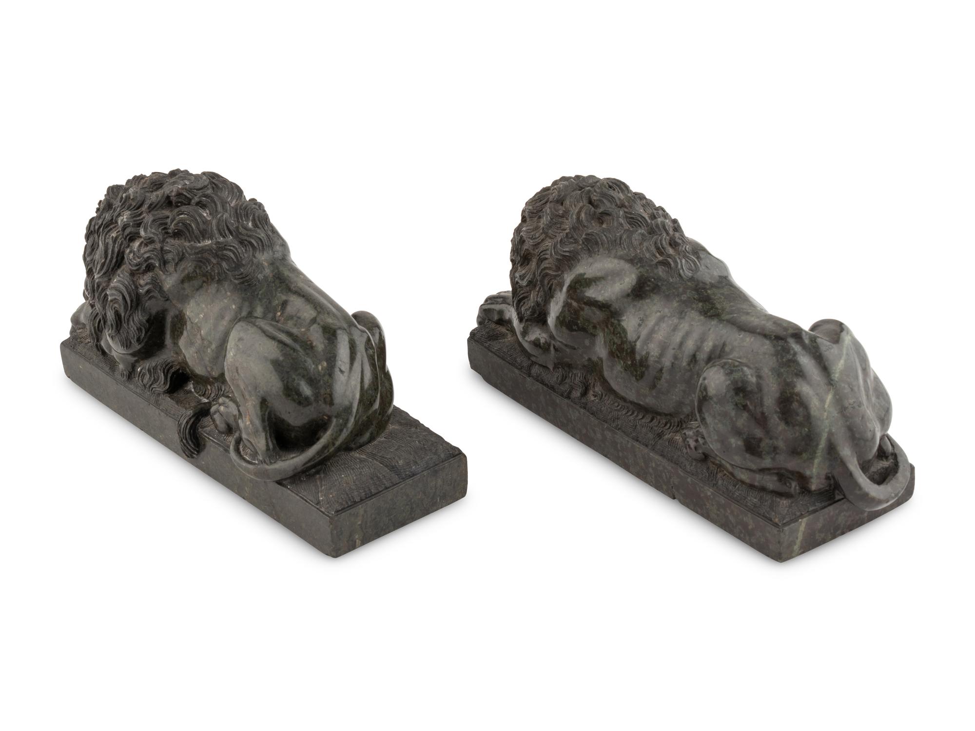 A Pair of Carved Green Marble Recumbent Lions