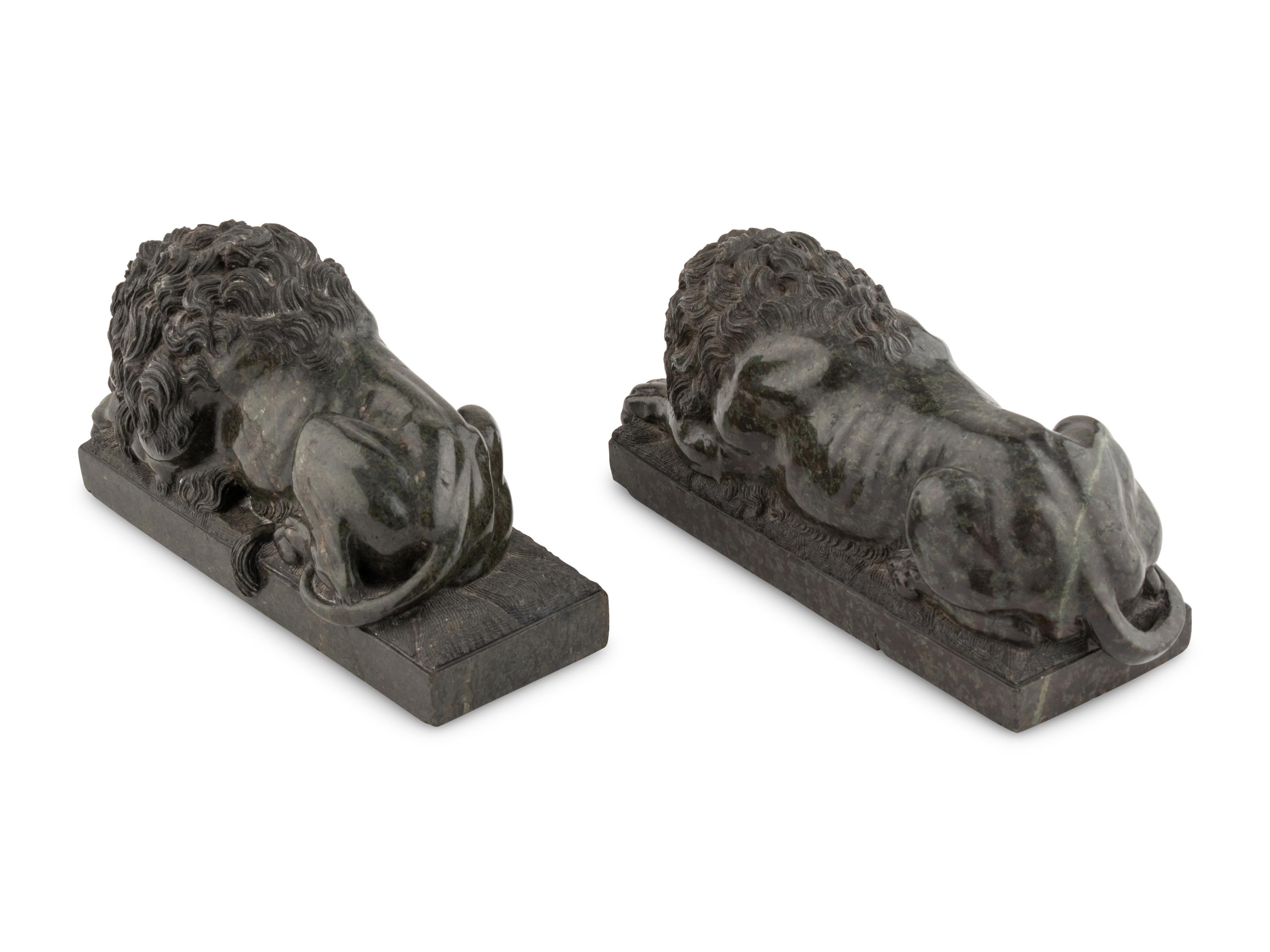 A Pair of Carved Green Marble Recumbent Lions