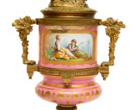 A Pair of Gilt Bronze Mounted Sèvres Style Porcelain Urns Mounted as Lamps