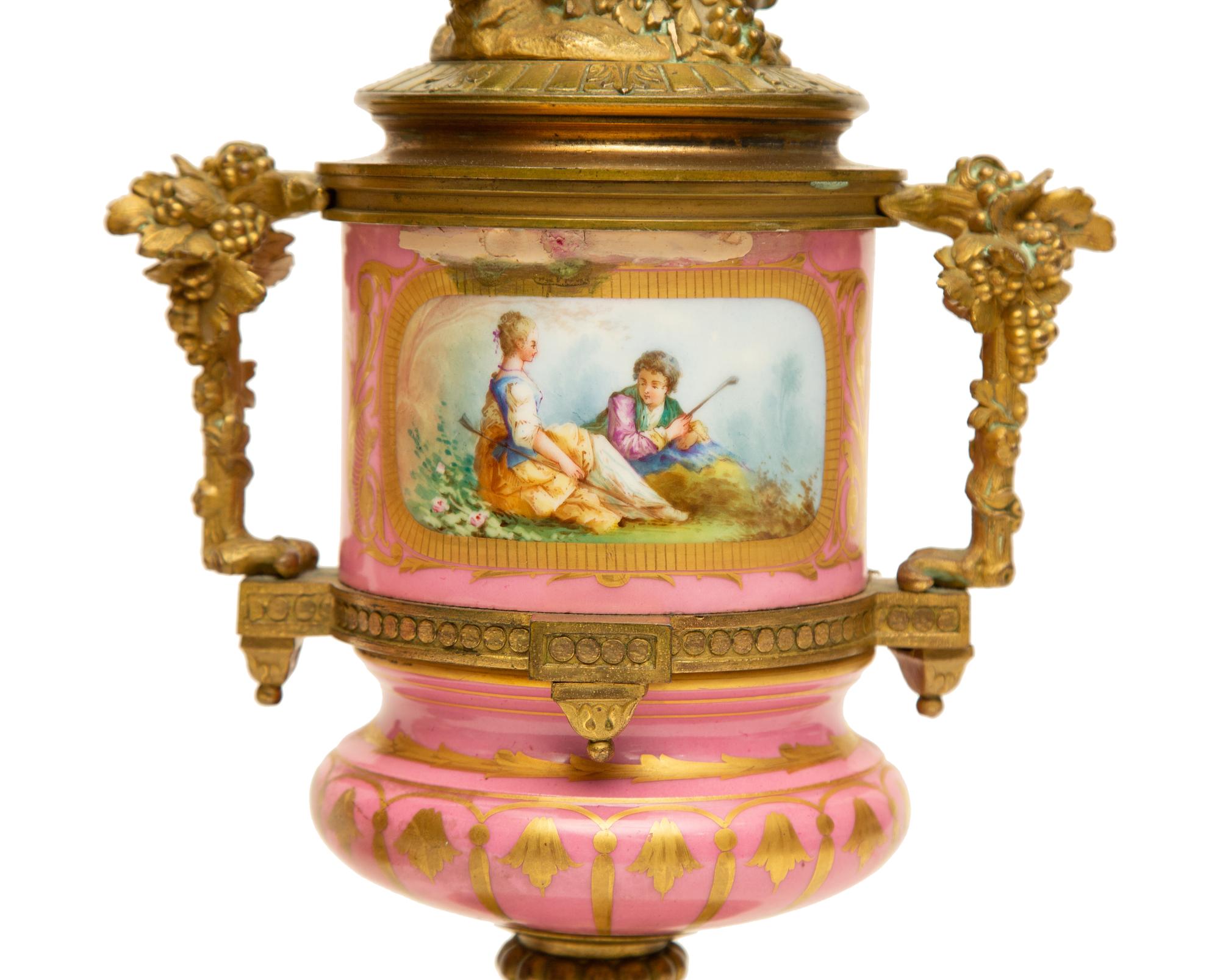 A Pair of Gilt Bronze Mounted Sèvres Style Porcelain Urns Mounted as Lamps