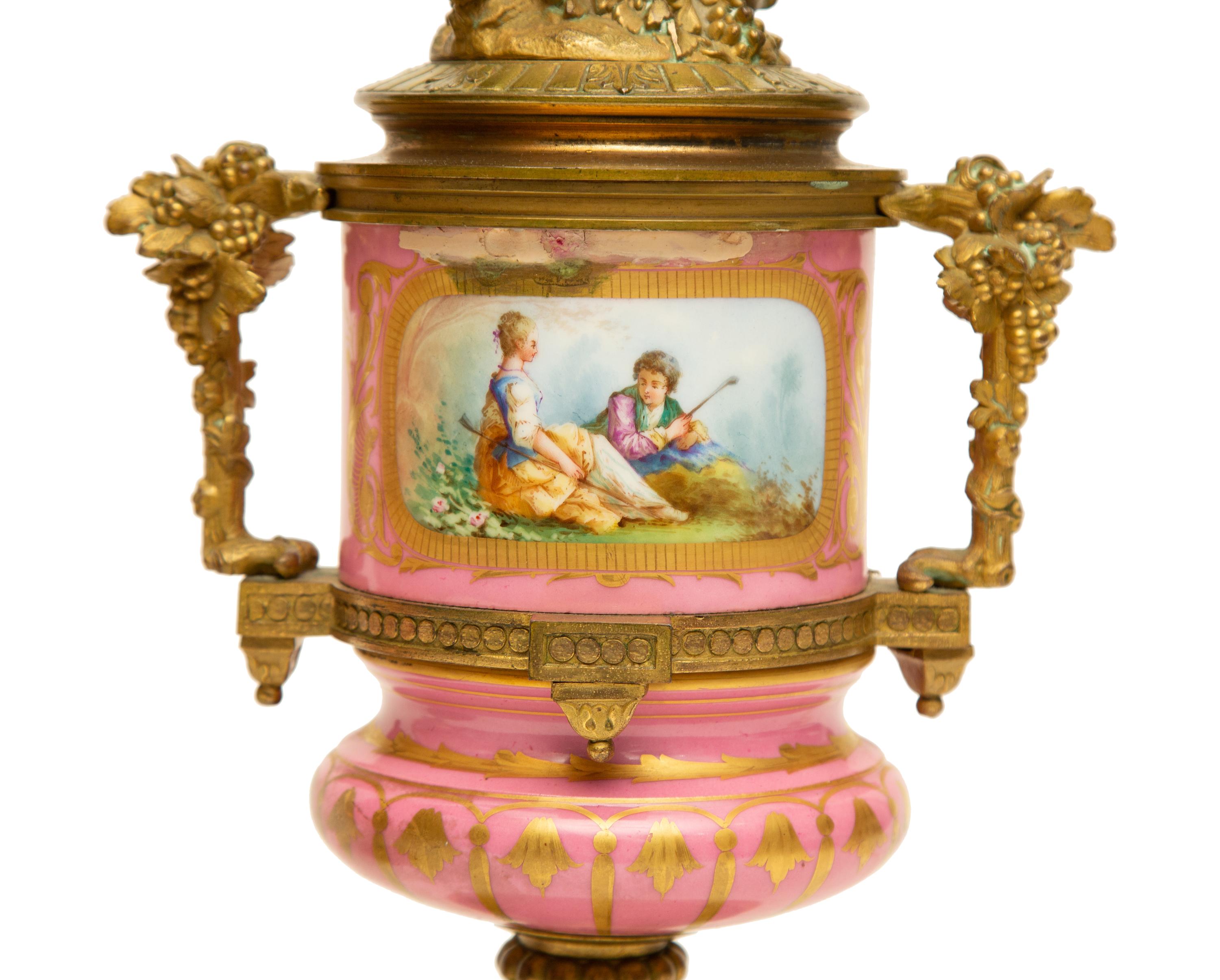 A Pair of Gilt Bronze Mounted Sèvres Style Porcelain Urns Mounted as Lamps