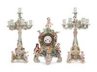 A Meissen Porcelain Clock Garniture and Clock Stand