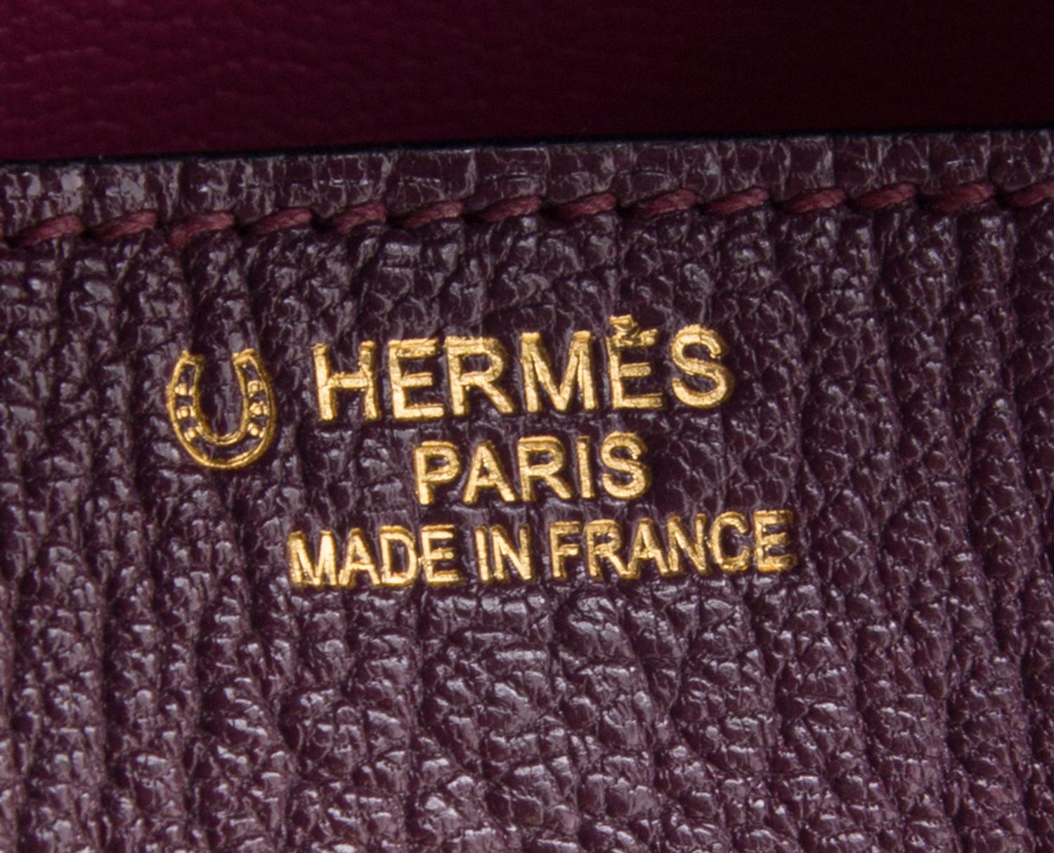 An Hermes Bicolor Raisin Togo 35cm Birkin Handbag, 14" x 10" x 7".