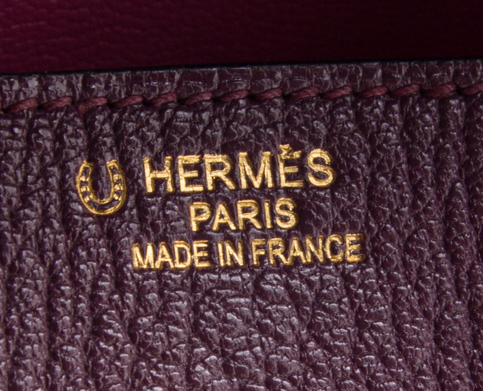An Hermes Bicolor Raisin Togo 35cm Birkin Handbag, 14" x 10" x 7".