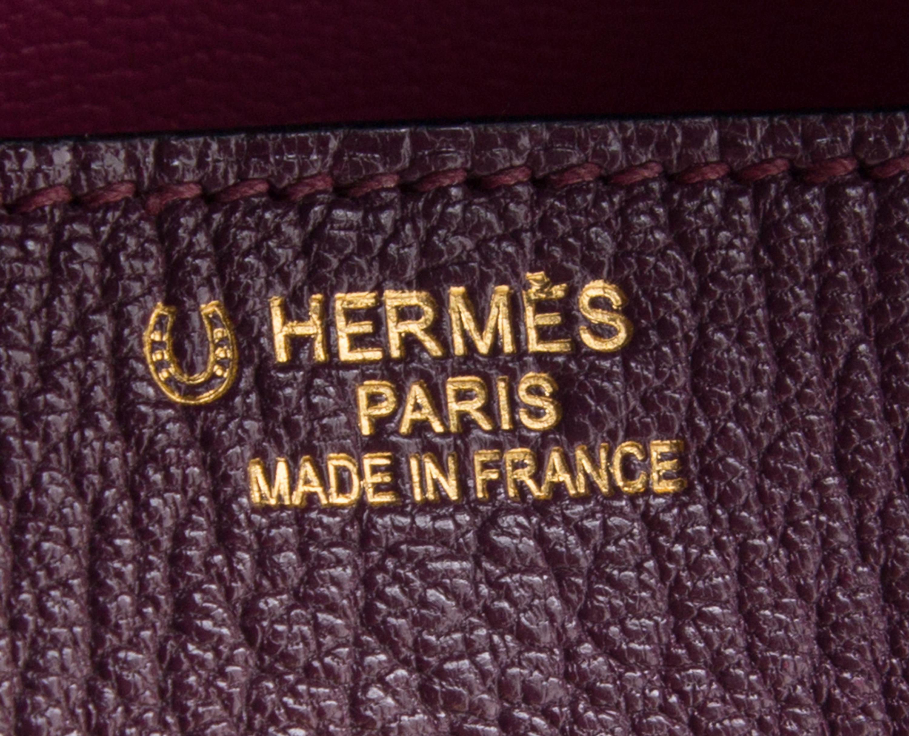 An Hermes Bicolor Raisin Togo 35cm Birkin Handbag, 14" x 10" x 7".