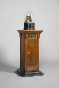 A Western Union Telegraph Company Stock Ticker with Base, Height of ticker 13 1/4 inches, height overall 43 inches.
