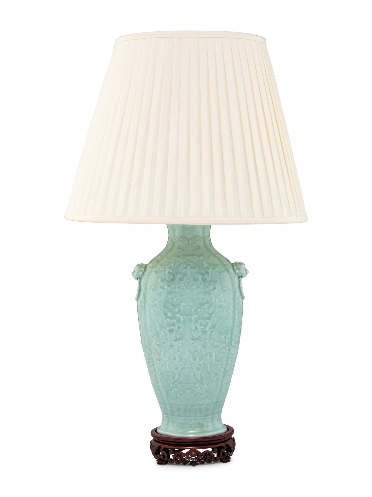 A Chinese Molded Celadon Ground Porcelain 'Phoenix' Vase