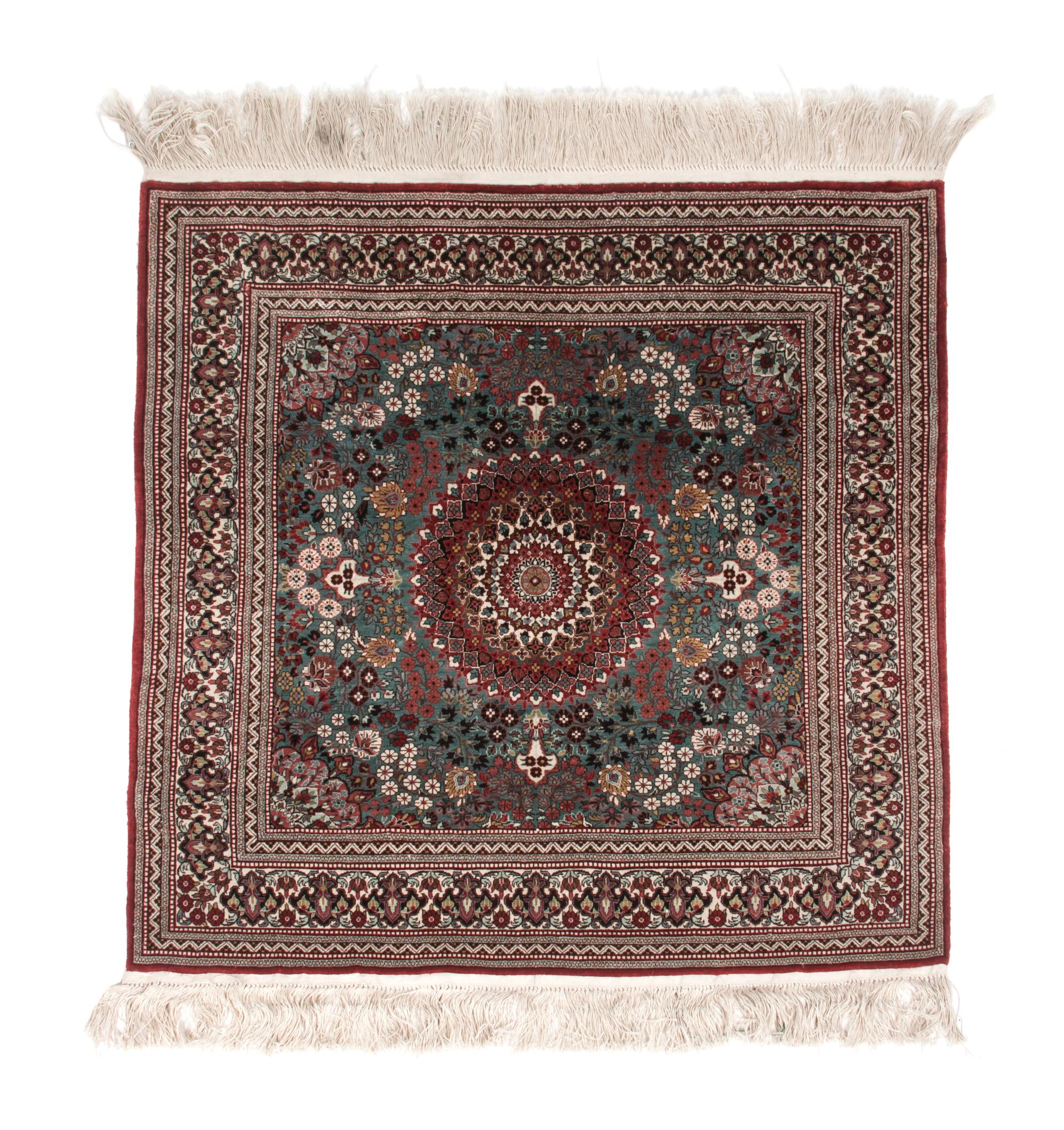 An Iranian Silk Rug 2 feet 8 inches x 2 feet 7 inches.