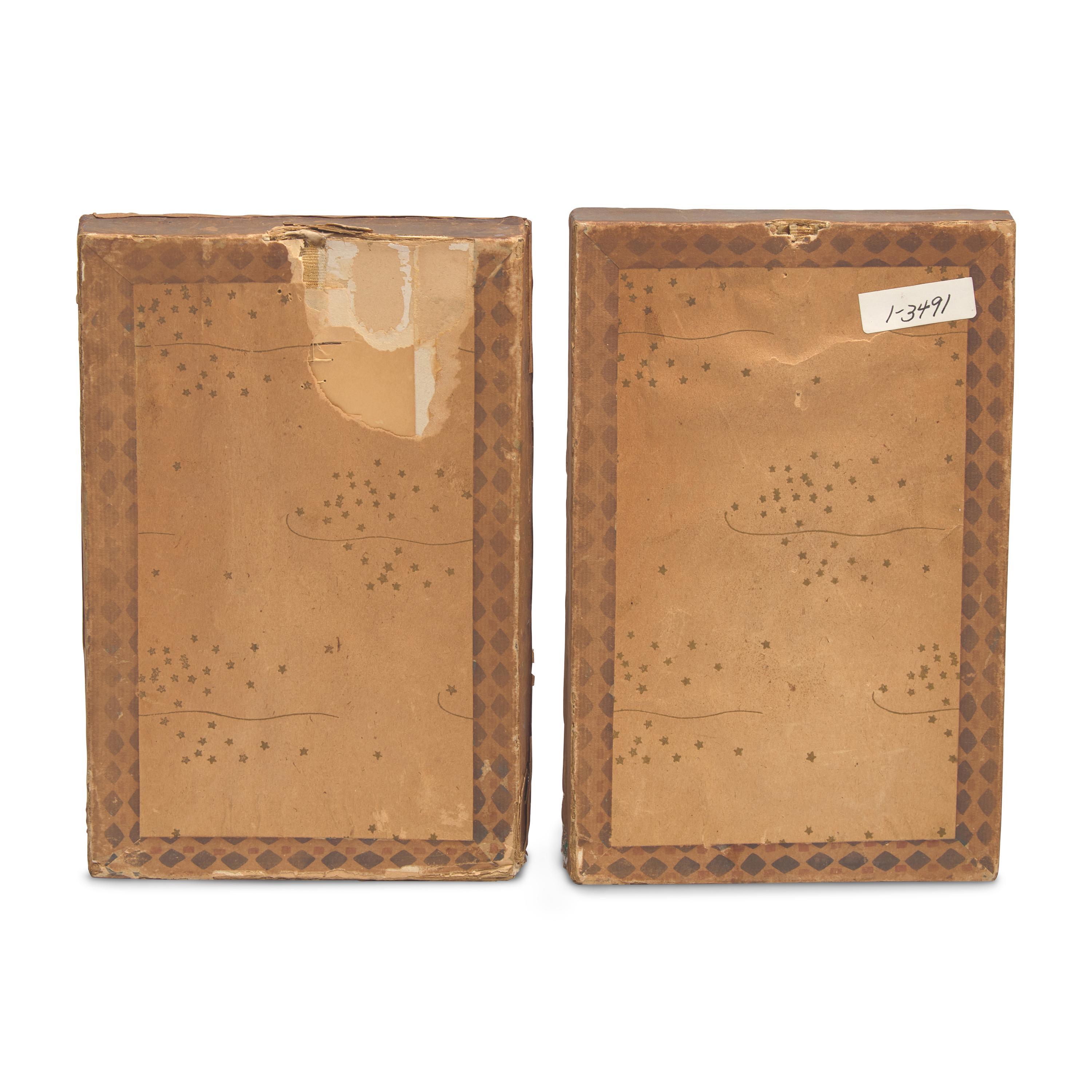 A Pair of Shadowboxes with Painted Paper Cut-Outs of An African-American Lady and Gentleman