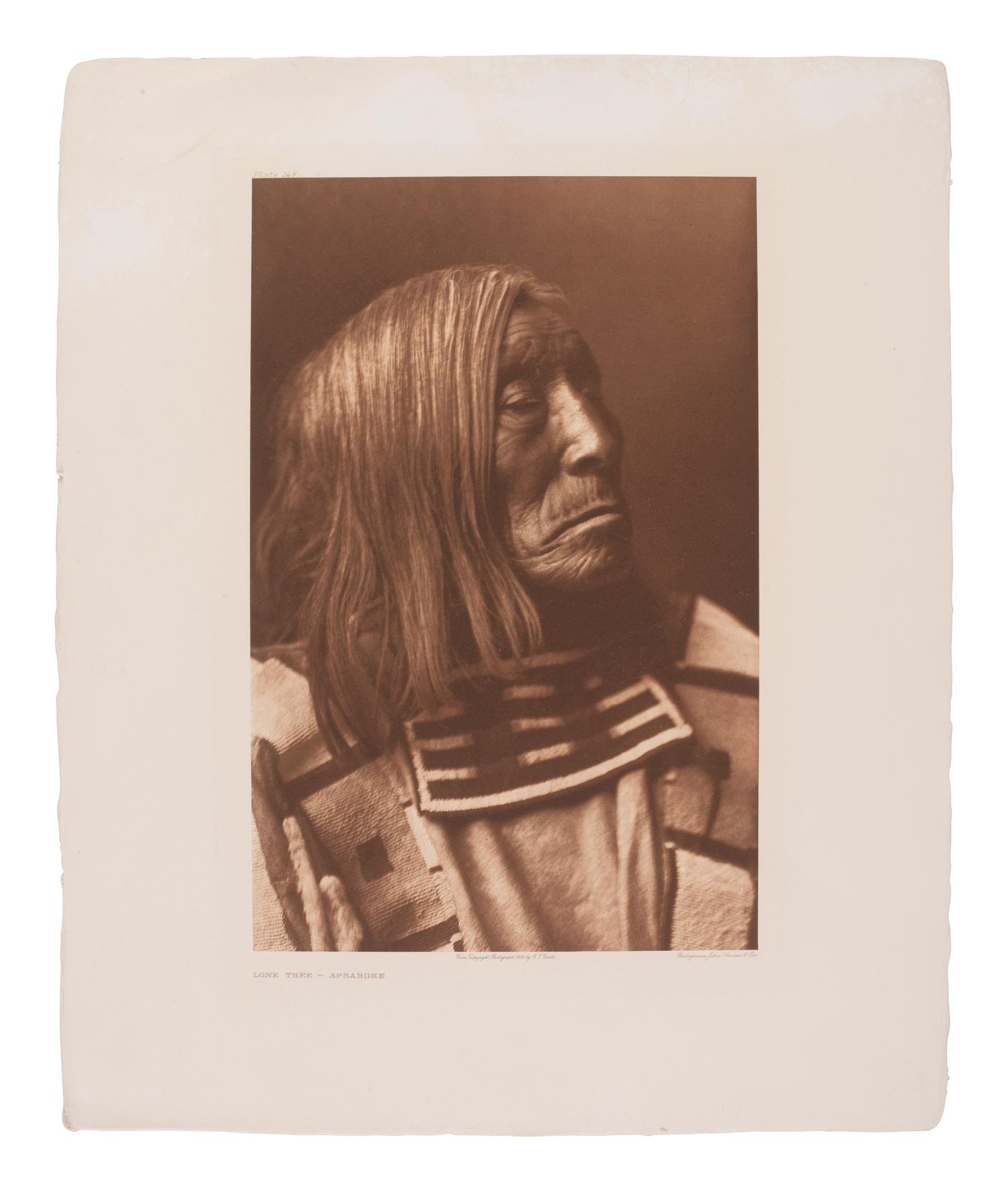 CURTIS, Edward (1868-1952), photographer. A group of 2 portfolio photogravures featuring Apsaroke subjects.