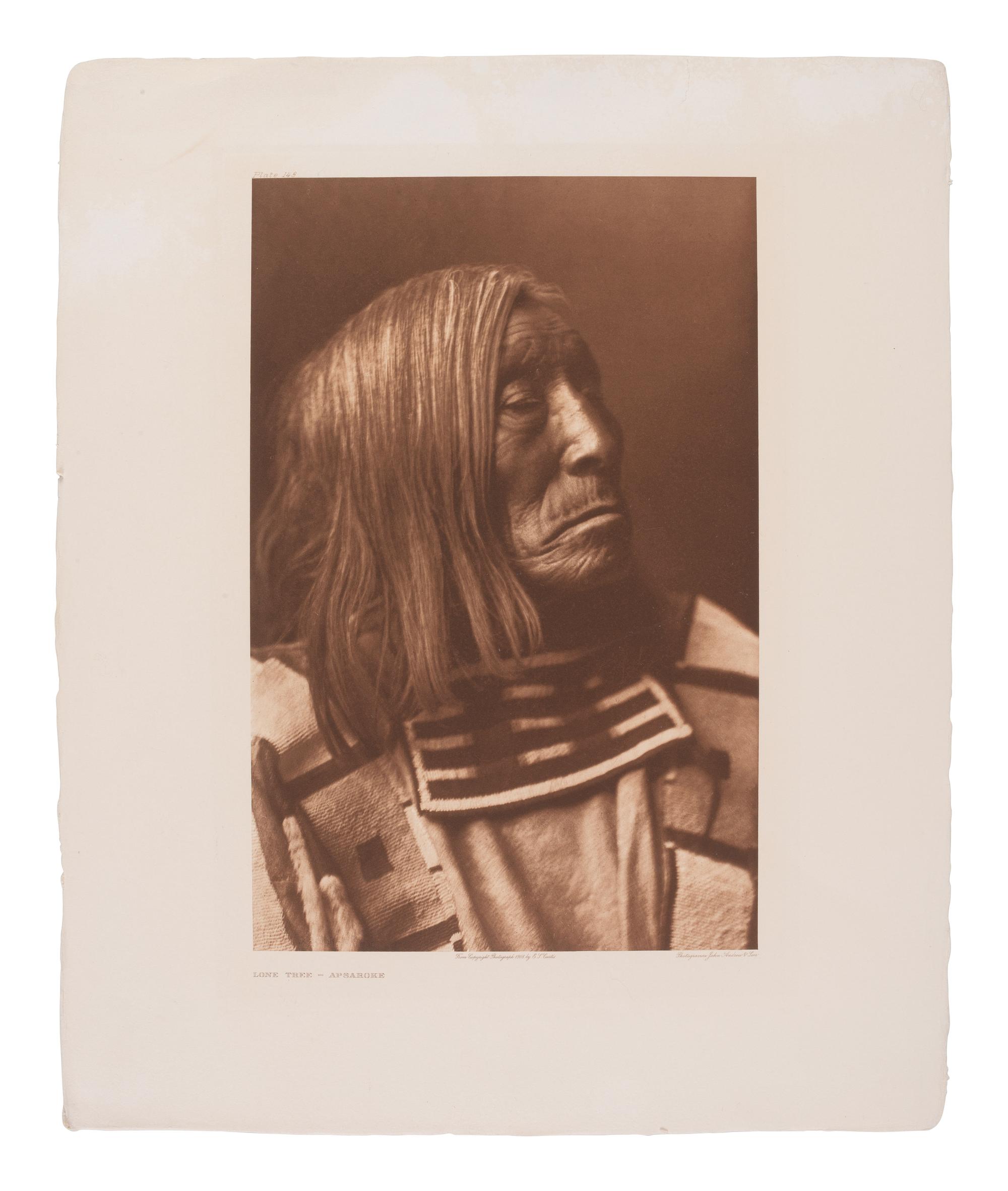 CURTIS, Edward (1868-1952), photographer. A group of 2 portfolio photogravures featuring Apsaroke subjects.