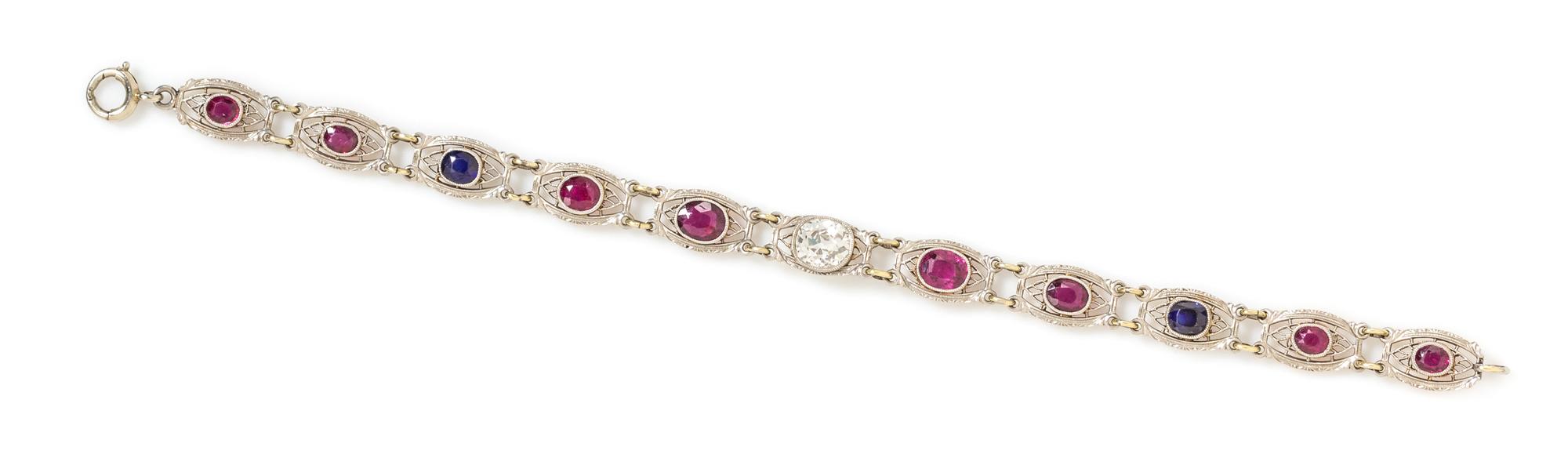 An Edwardian Platinum Topped Gold, Diamond, Ruby and Sapphire Bracelet, Krementz & Co., 5.35 dwts.