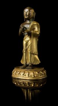 A Sino-Tibetan Gilt Bronze Figure of a Standing Buddhist Monk — 18TH-19TH CENTURY