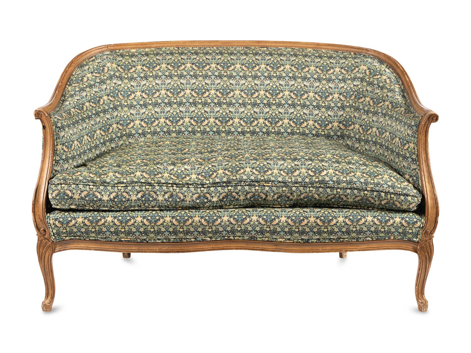 A Louis XV Style Settee with Strawberry Thief Upholstery