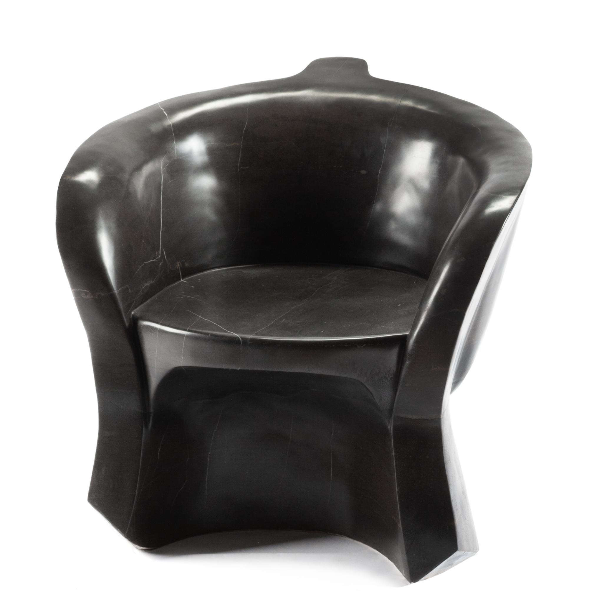 A Pair of Italian Marble "Face" Chairs Height 27 x width 27 1/2 x depth 27 inches.