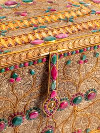 A Ruby and Emerald-Mounted Silvered and Gilt Filigree Table Casket