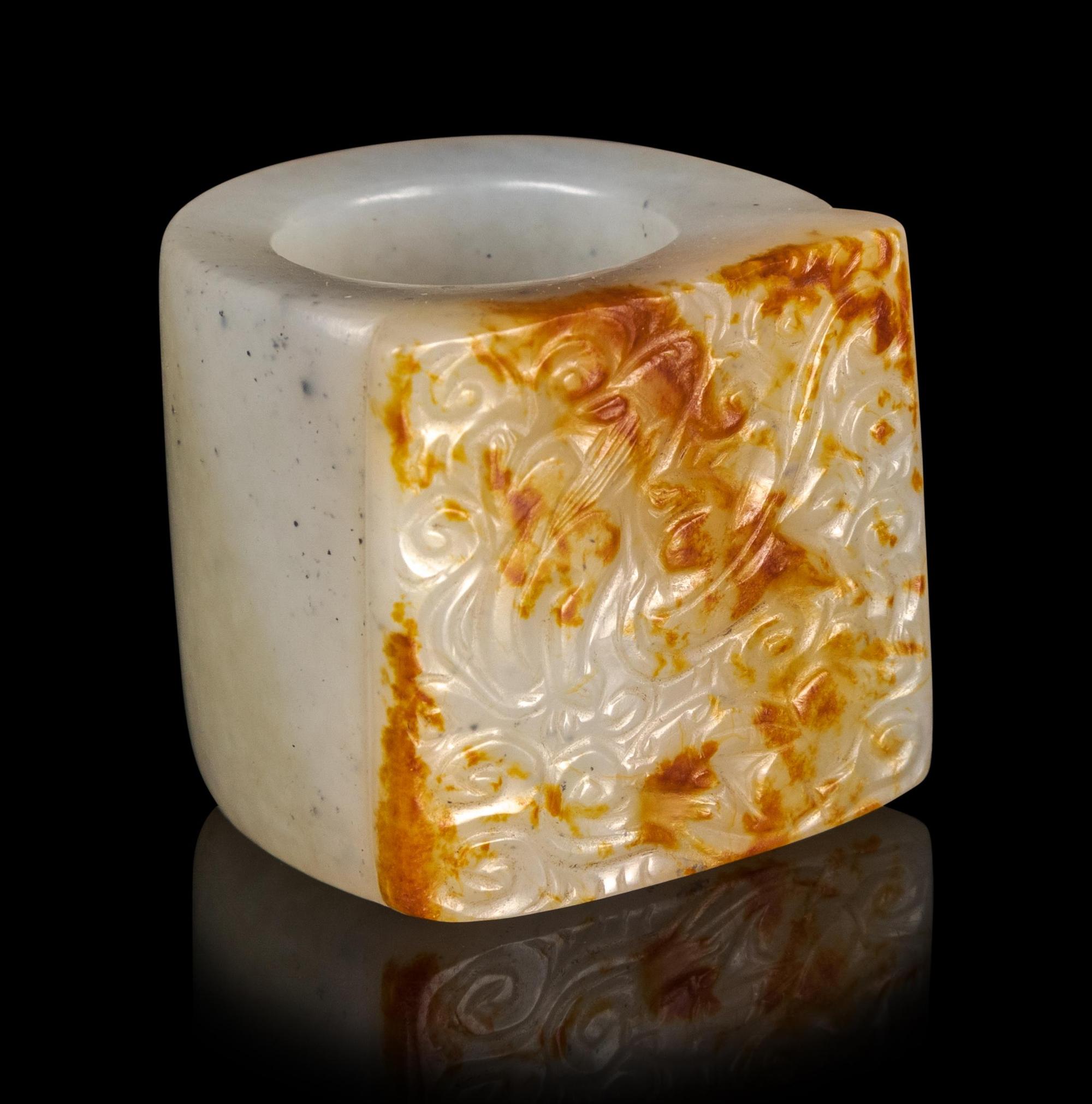 A Russet and White Jade Archer's Ring