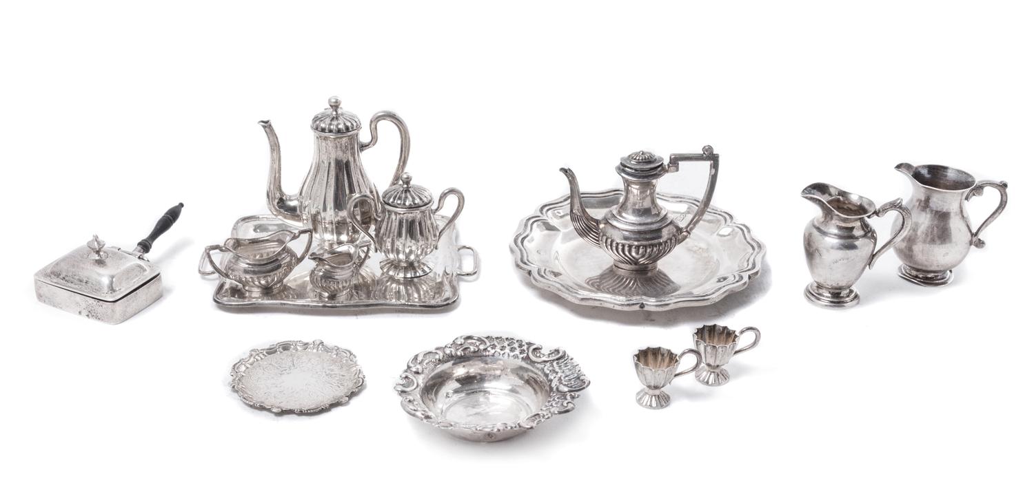 A Collection of Miniature Silver Table Articles, Various Makers, comprising two trays, two teapots, two water pitchers, a covered sugar