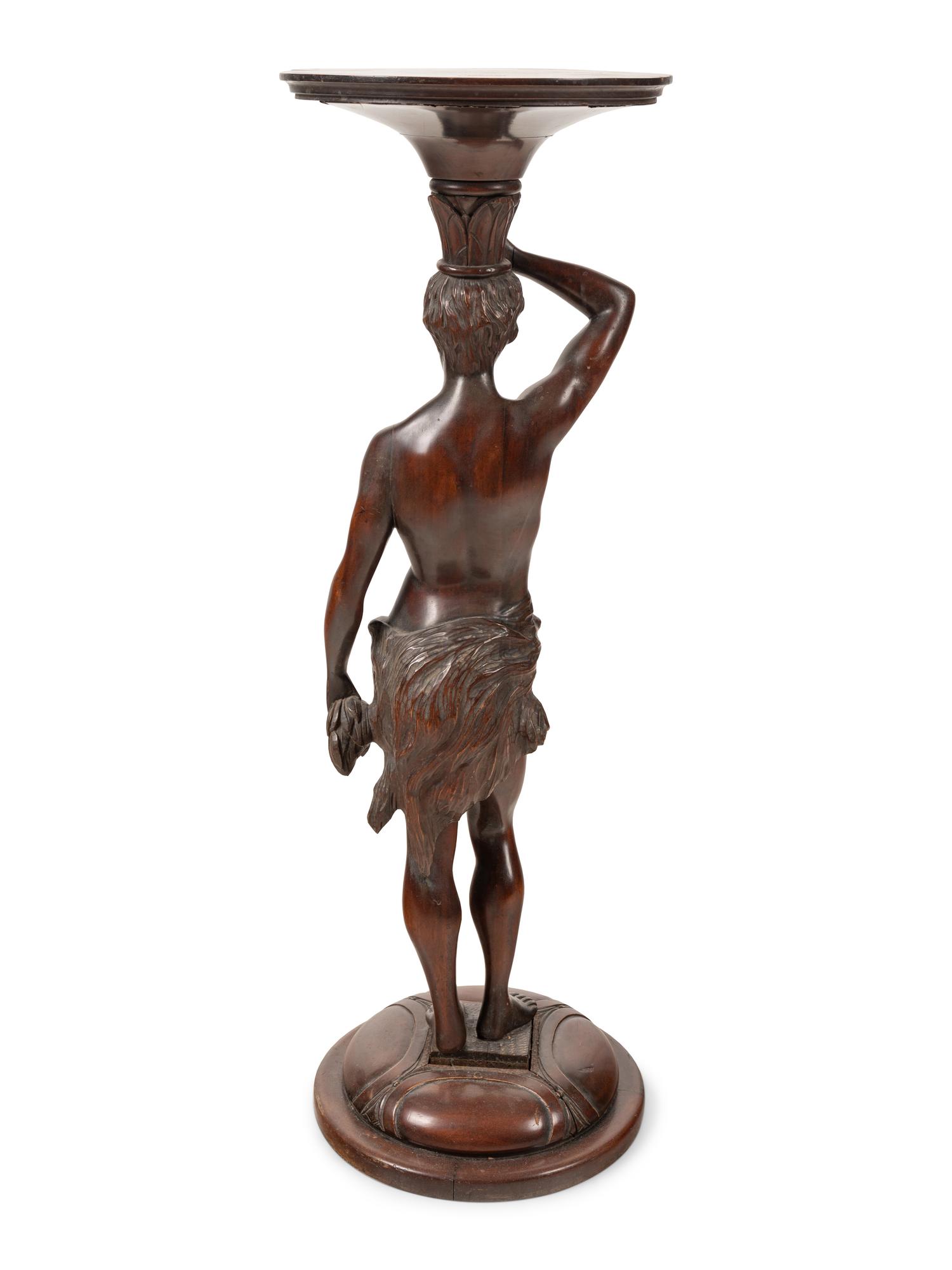 A Continental Carved Mahogany Figural Pedestal