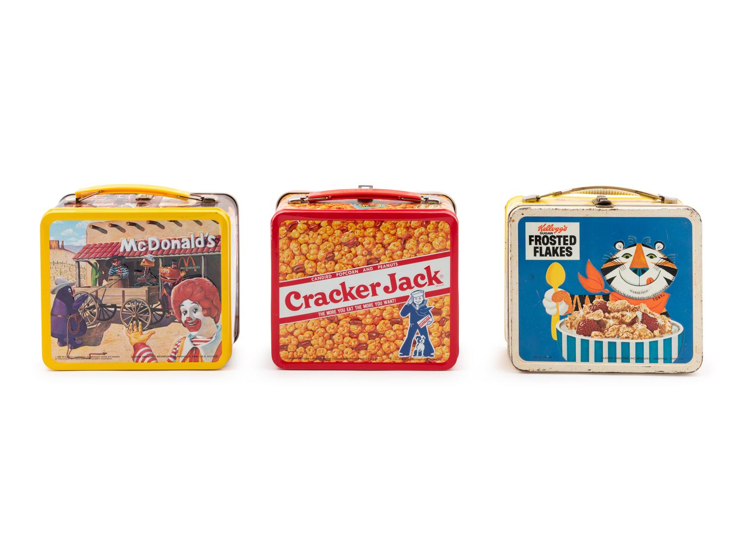 A "Cracker Jack" Lunch Box, a "Ronald McDonald" Lunch Box and a "Frosted Flakes" Lunch Box