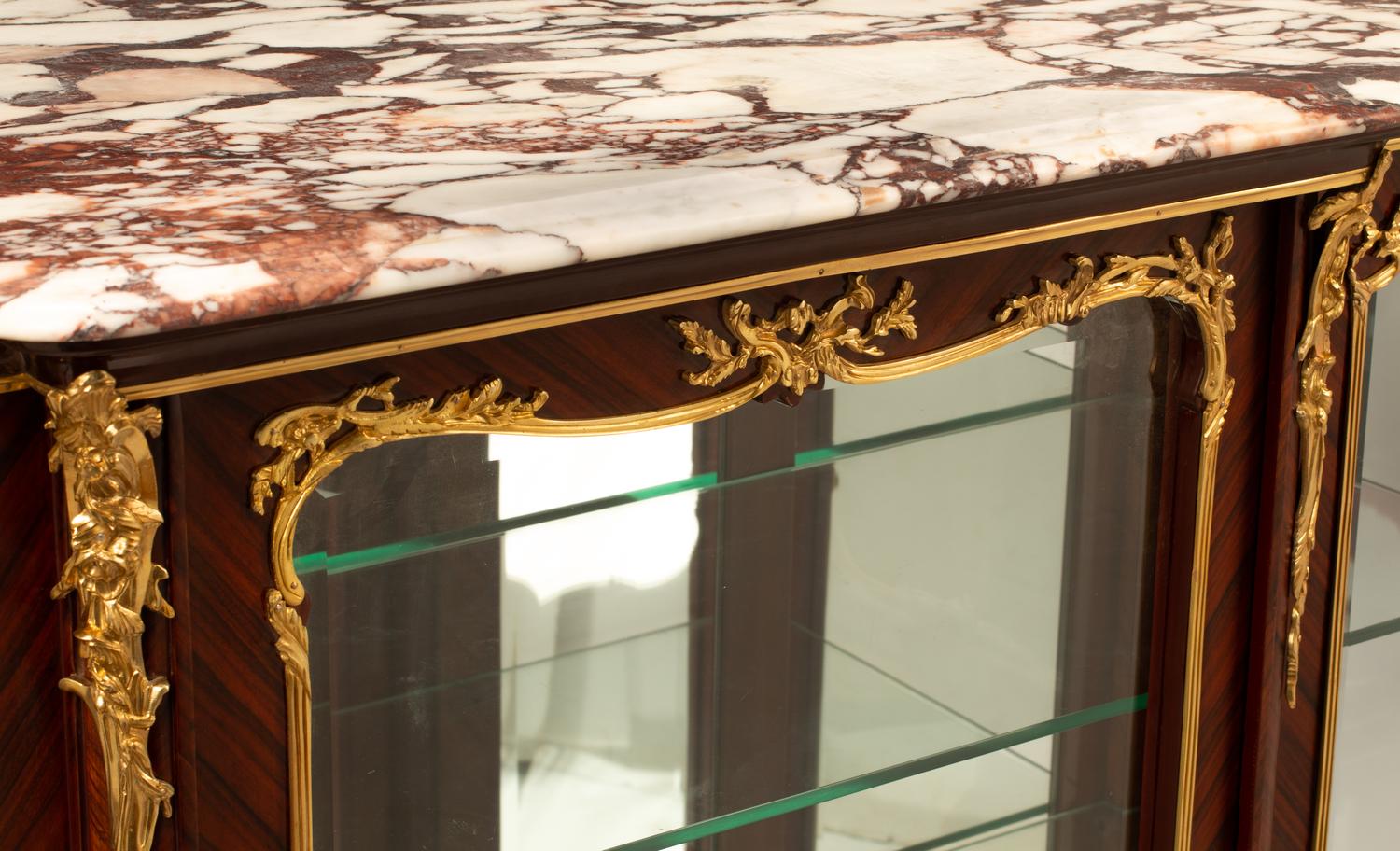 A Louis XV Style Gilt Bronze Mounted Marble-Top Vitrine Cabinet
