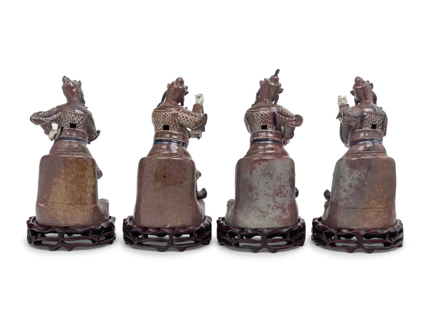 A Set of Four Chinese Underglaze Blue and Red Porcelain Figures of Guardians