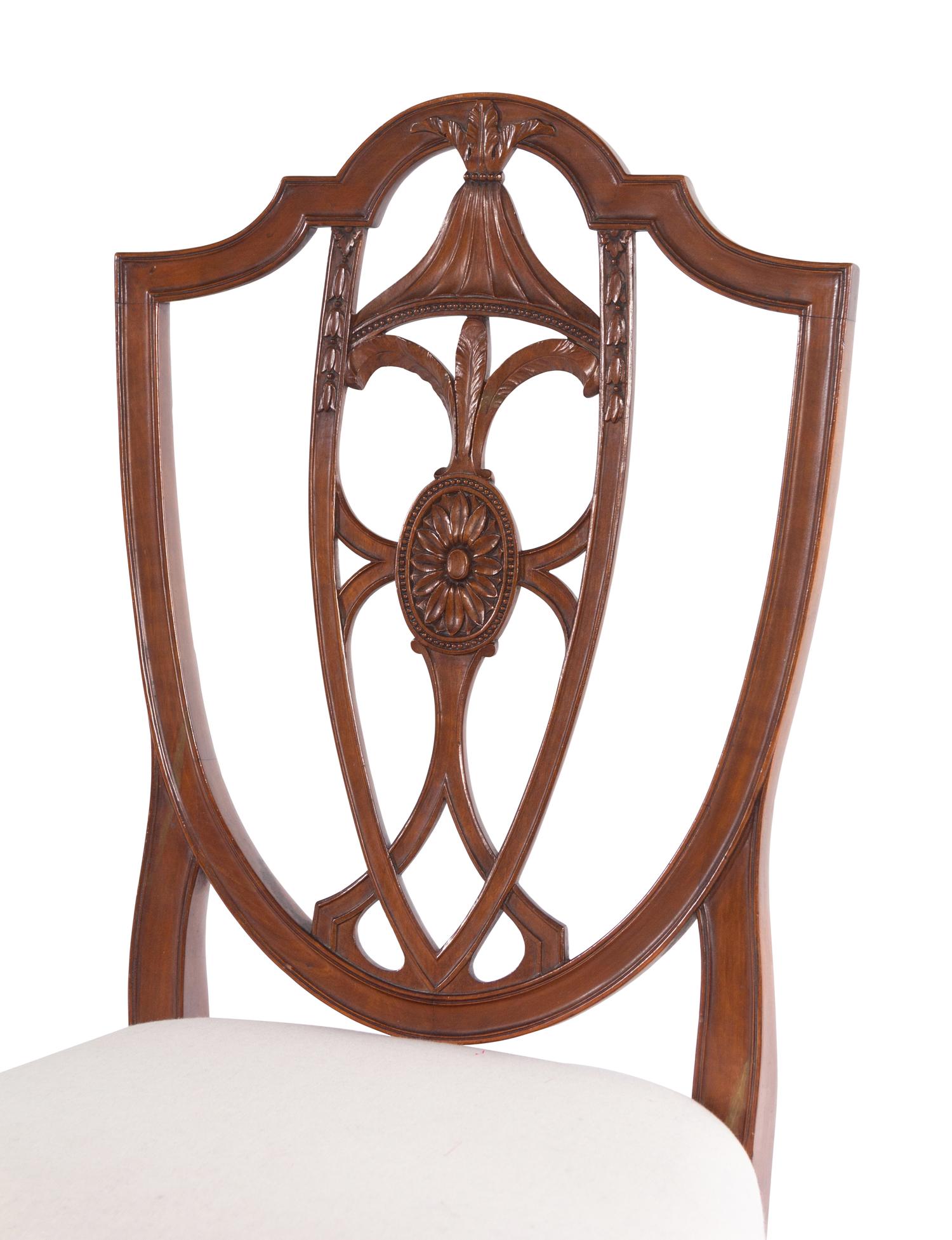 A Set of Four Federal Carved Cherrywood Shield-Back Dining Chairs