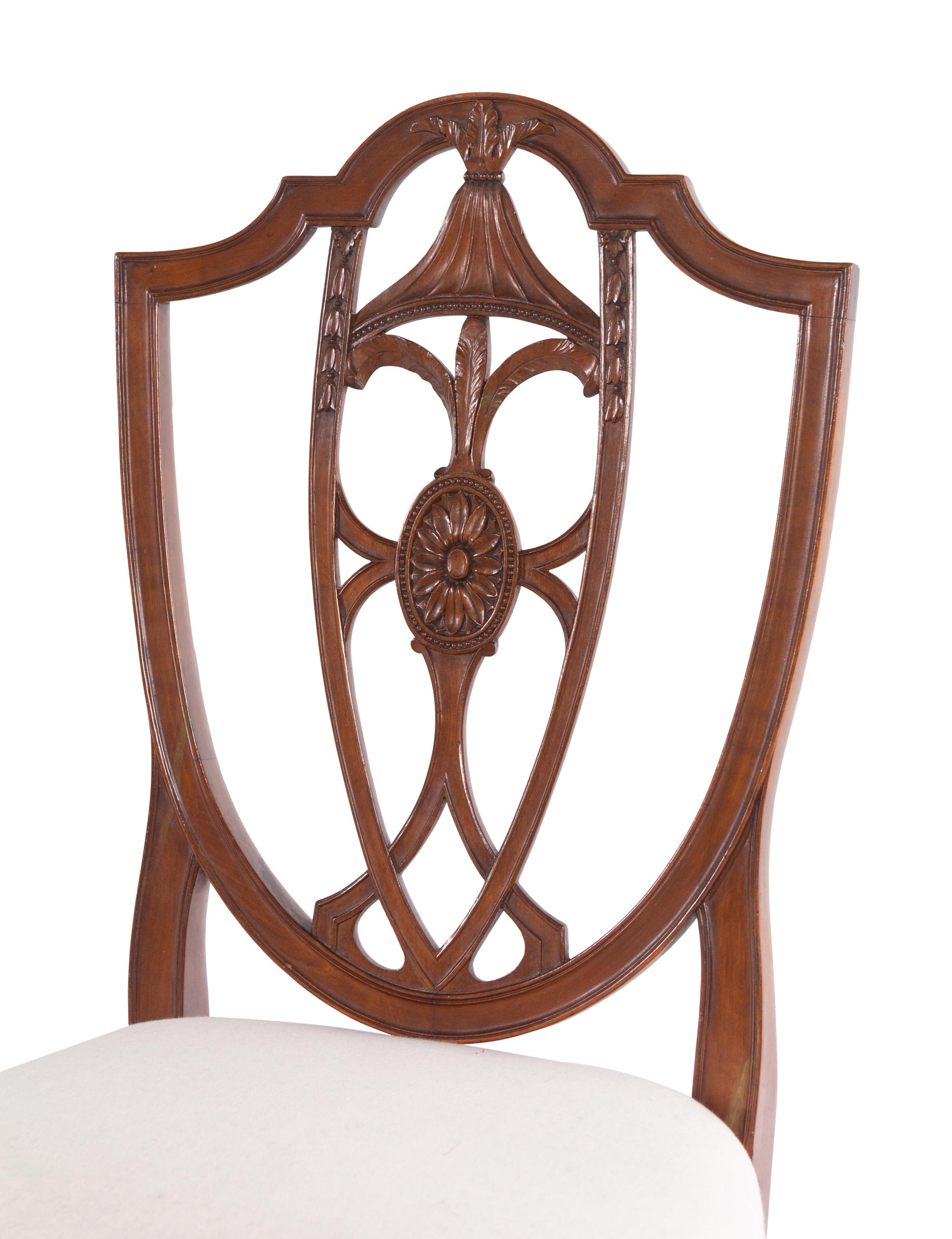 A Set of Four Federal Carved Cherrywood Shield-Back Dining Chairs