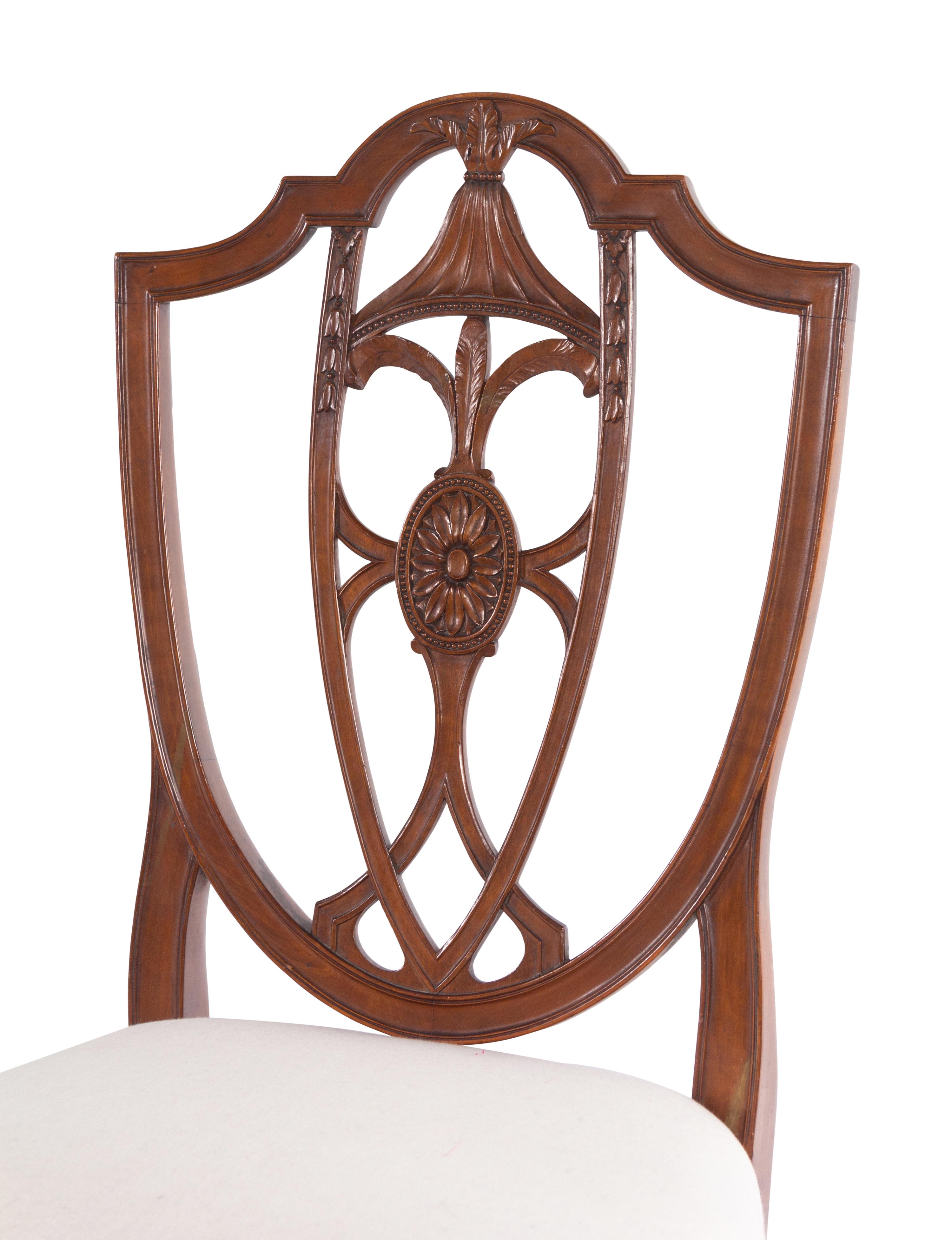 A Set of Four Federal Carved Cherrywood Shield-Back Dining Chairs