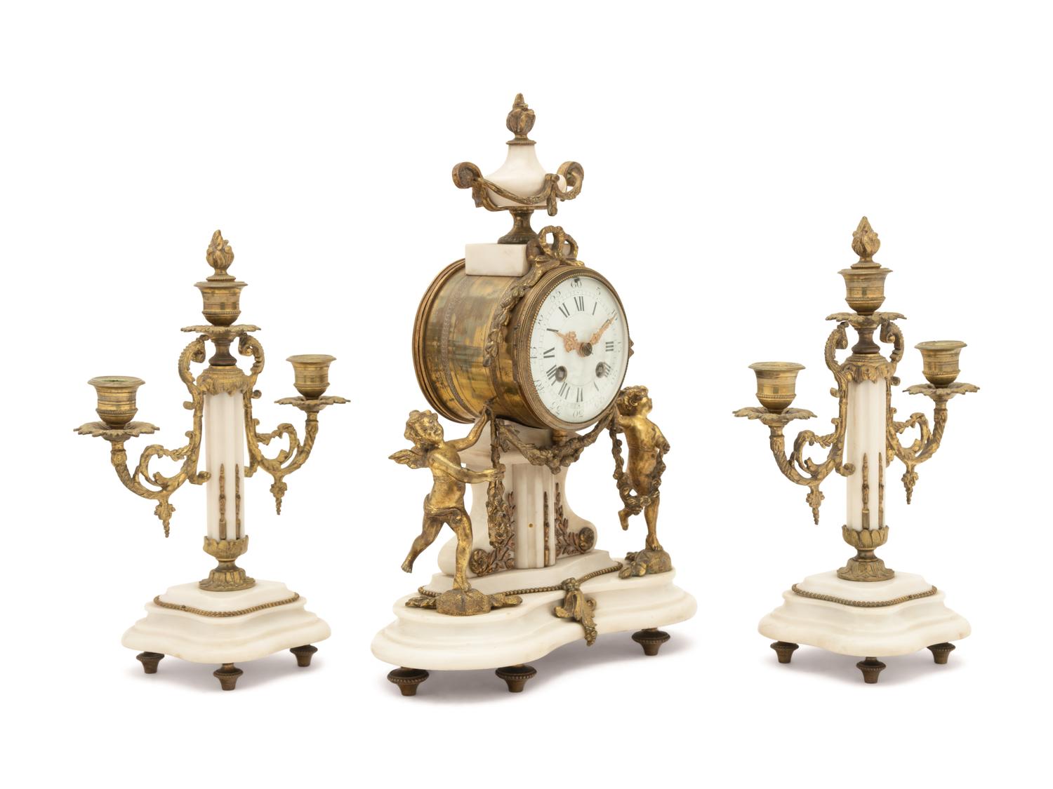 A Louis XVI Style Gilt Metal Mounted Marble Clock Garniture