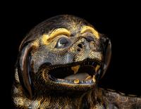 A Chinese Export Gilt Decorated Black Glazed Porcelain Figure of Fu Lion