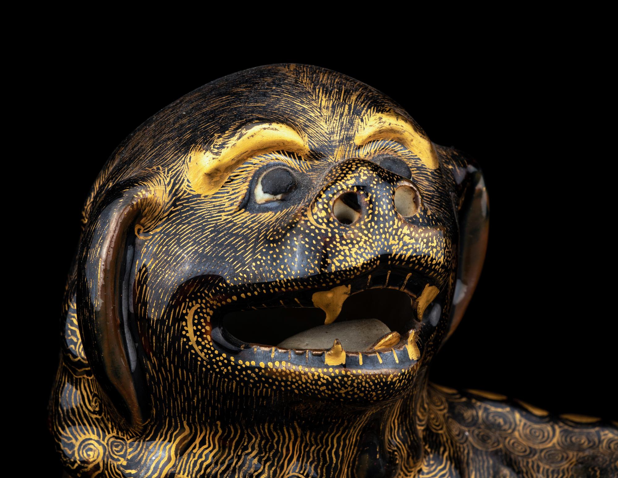 A Chinese Export Gilt Decorated Black Glazed Porcelain Figure of Fu Lion