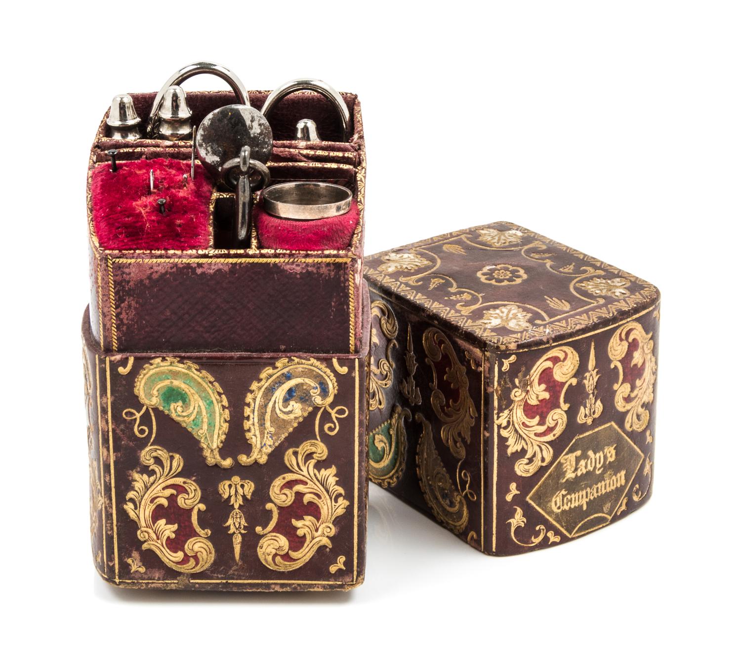 An English Silver and Silver-Plate Necessaire, , the tooled leather case with gilt and polychrome foliate and volute decoration opening