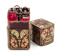 An English Silver and Silver-Plate Necessaire, , the tooled leather case with gilt and polychrome foliate and volute decoration opening