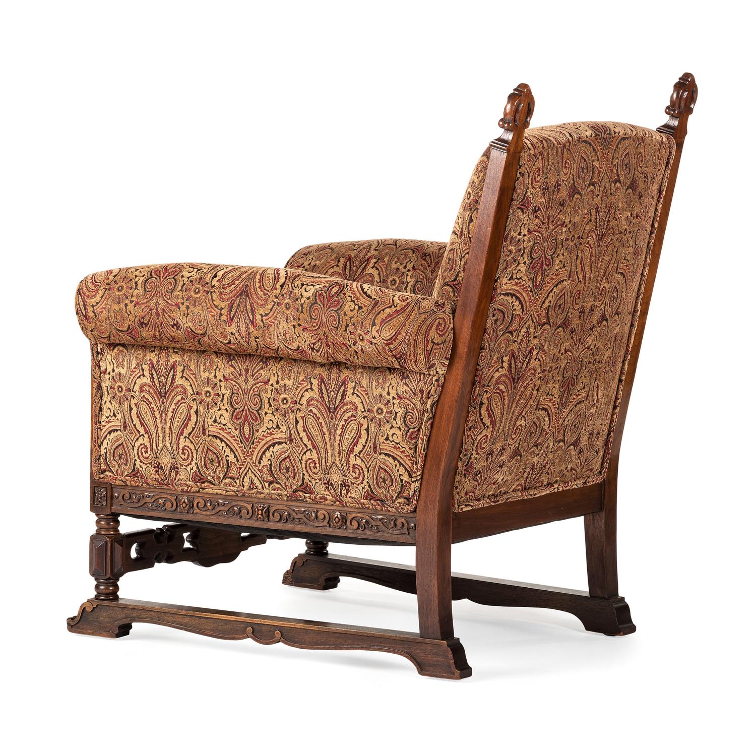 A Jacobean Style Carved Oak Sofa and Armchair