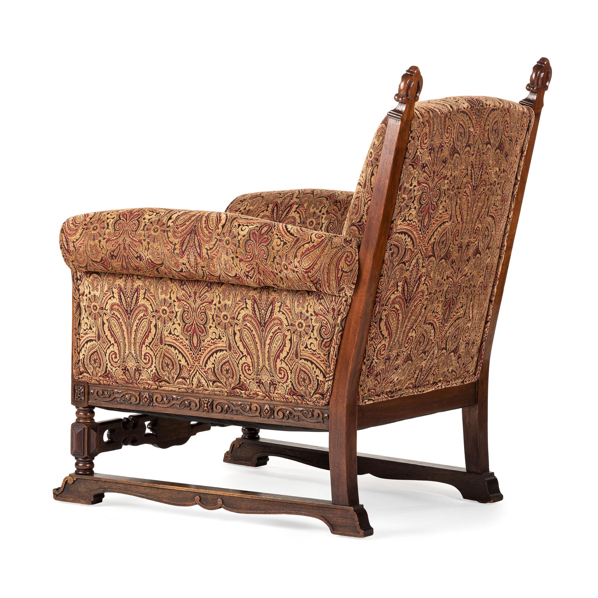 A Jacobean Style Carved Oak Sofa and Armchair