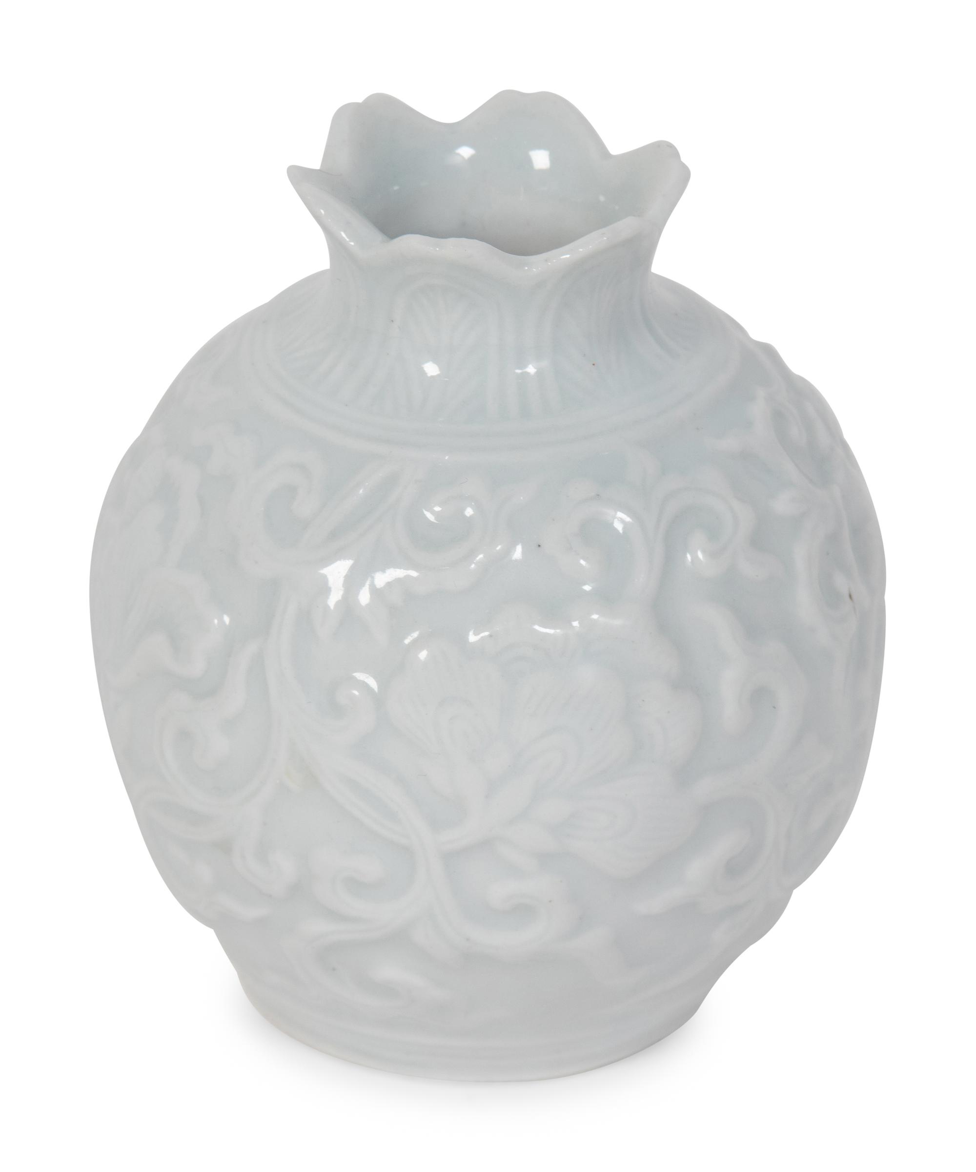 A Japanese Carved White Glazed Porcelain Pomegranate-Form Jar