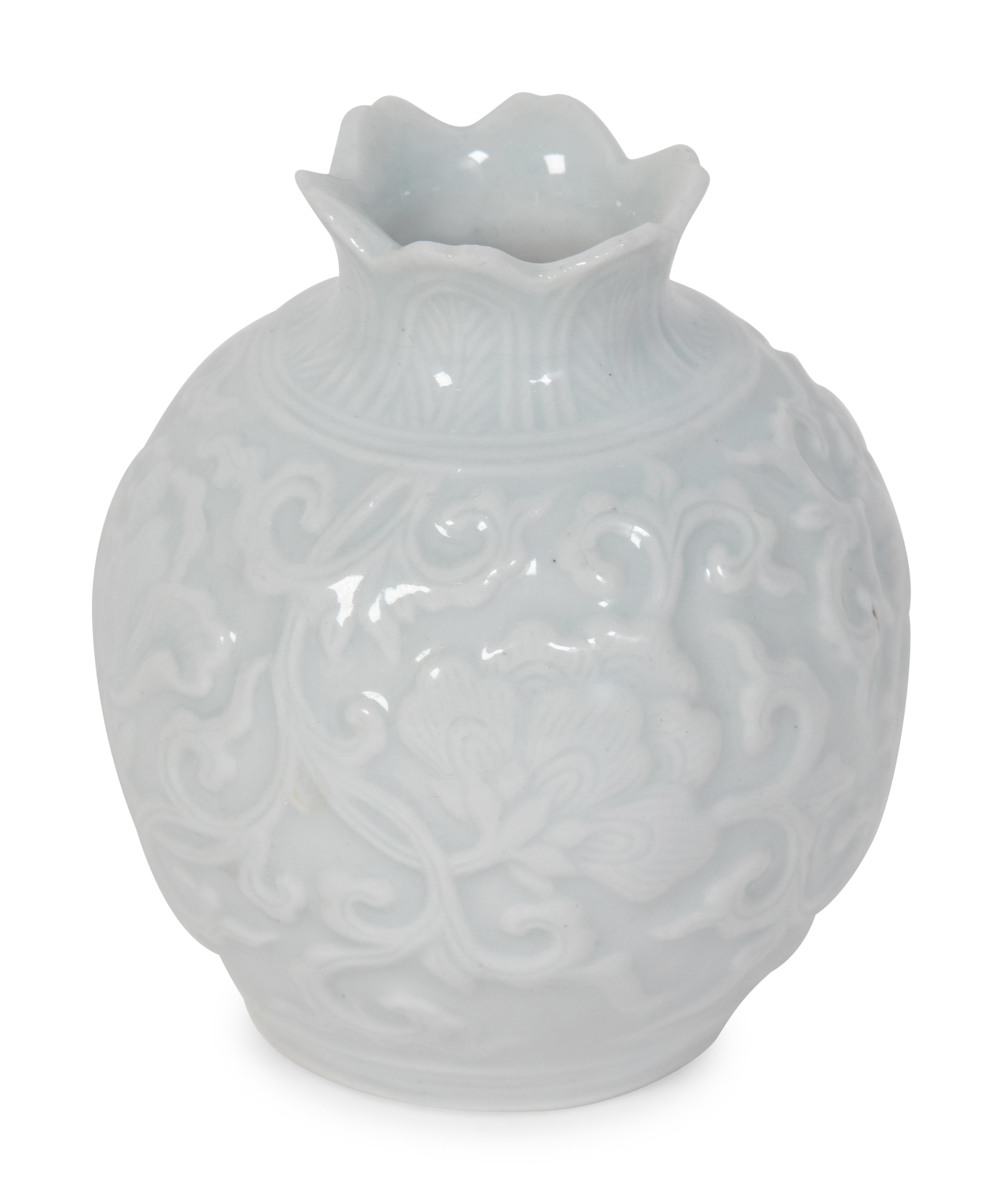 A Japanese Carved White Glazed Porcelain Pomegranate-Form Jar