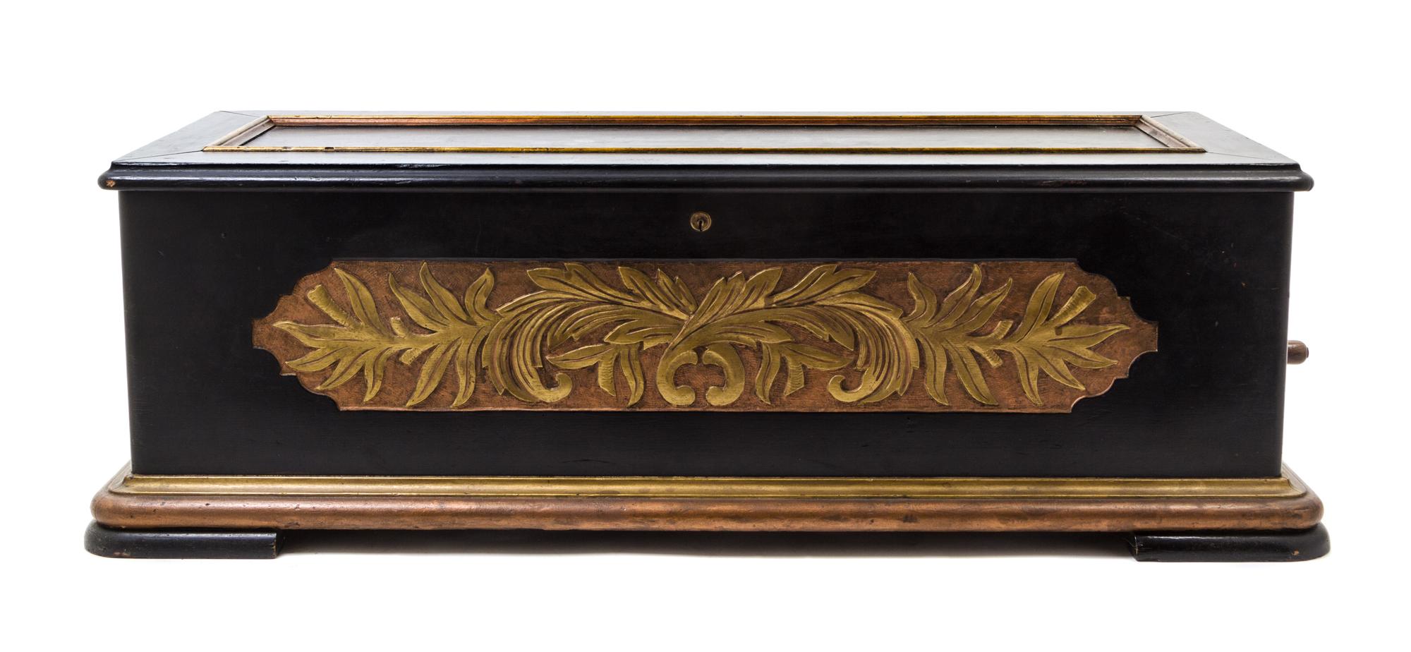 A Continental Cylinder Music Box Height of case 12 x width 37 x depth 14 inches.