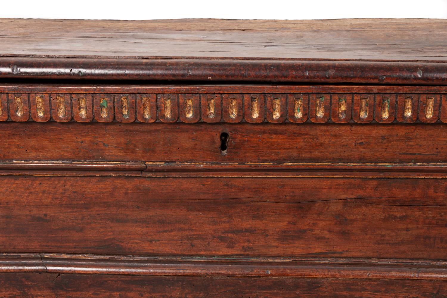 A Spanish Parcel Gilt Carved Walnut Chest