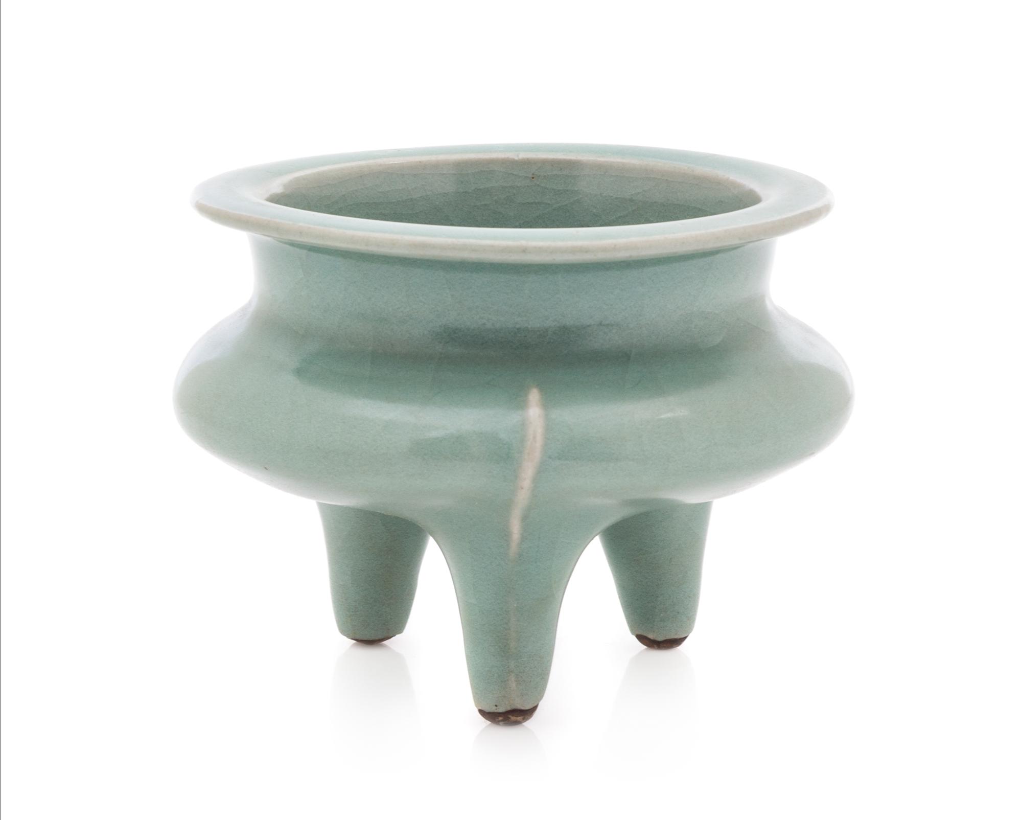 A Chinese Longquan Celadon Glazed Porcelain Tripod Censer SONG DYNASTY OR LATER Height 3 1/4 inches. — SONG DYNASTY OR LATER