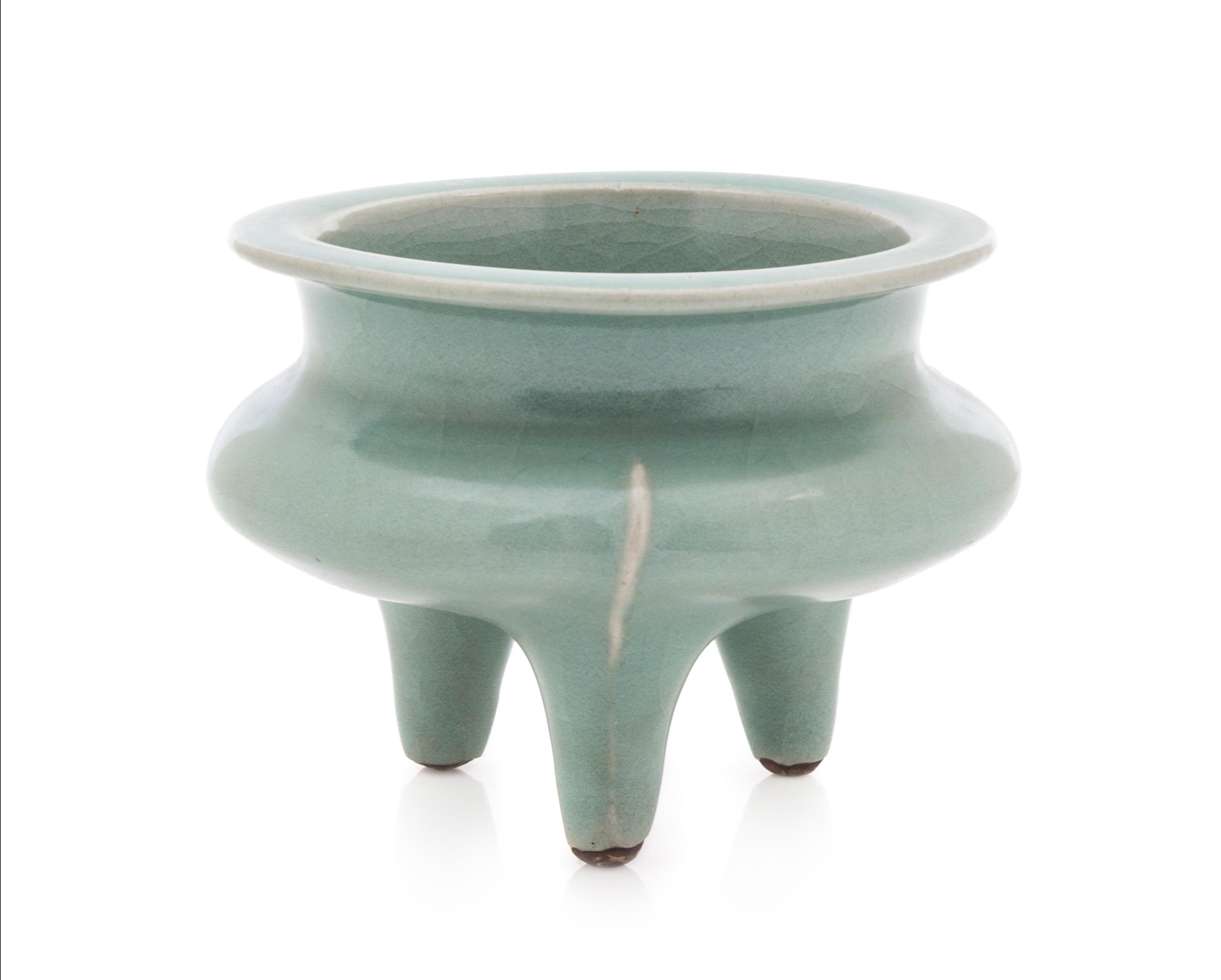 A Chinese Longquan Celadon Glazed Porcelain Tripod Censer SONG DYNASTY OR LATER Height 3 1/4 inches. — SONG DYNASTY OR LATER