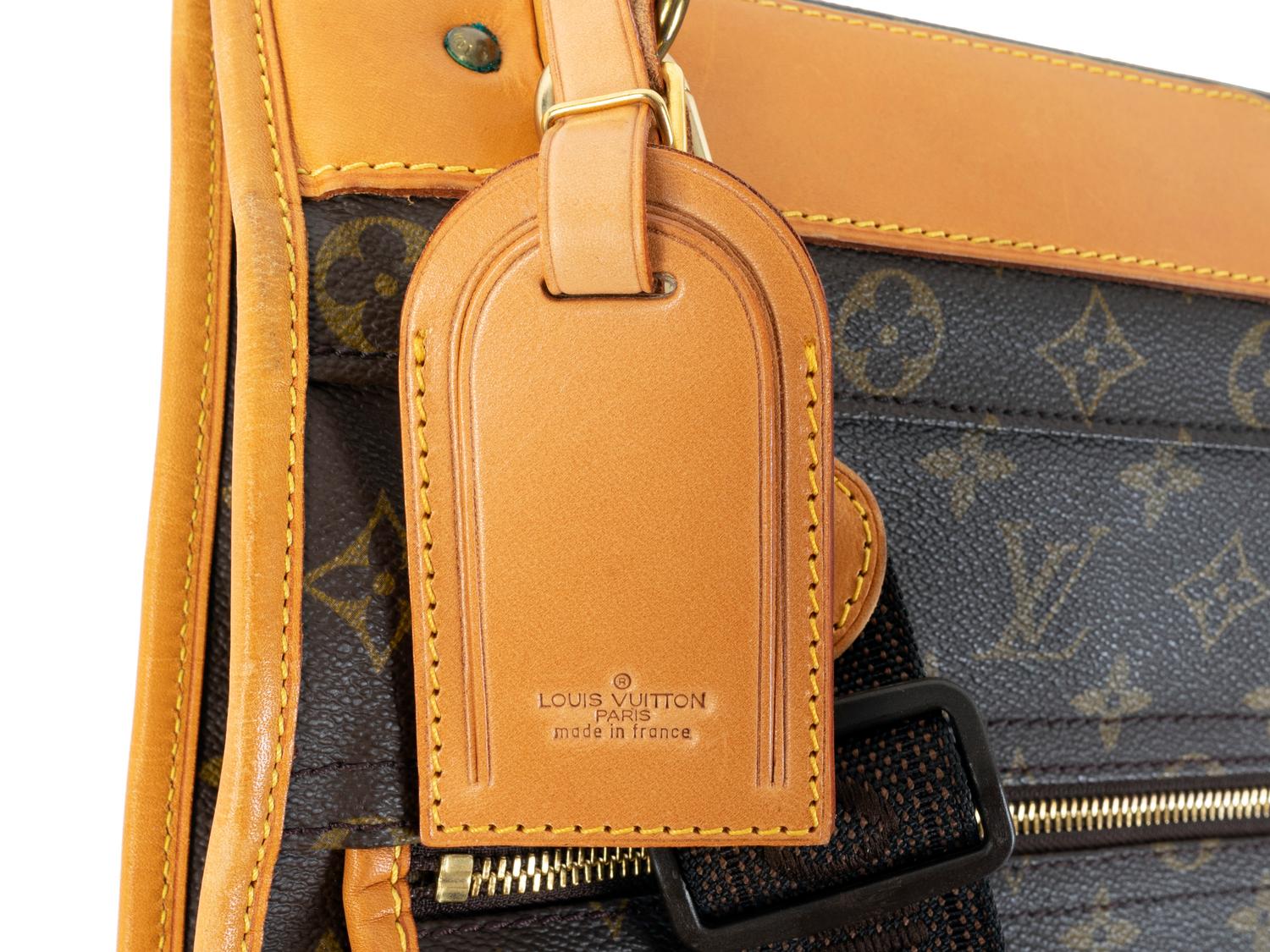 A Louis Vuitton Leather Garment Bag — 20TH CENTURY