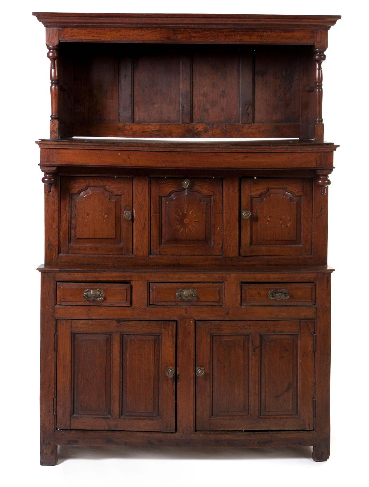 An English Oak Cupboard, Height 80 3/4 x width 53 x depth 20 1/4 inches.