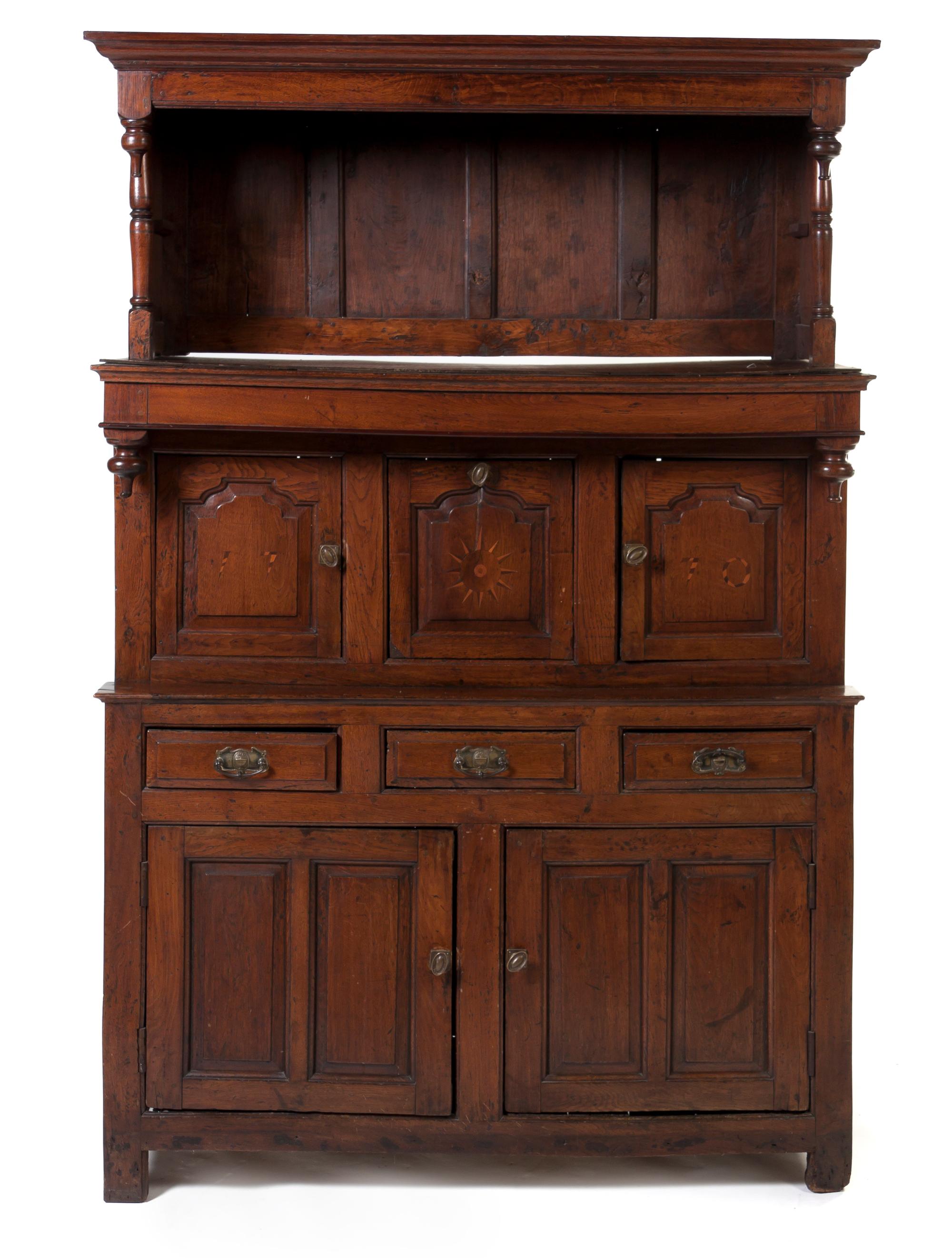 An English Oak Cupboard, Height 80 3/4 x width 53 x depth 20 1/4 inches.