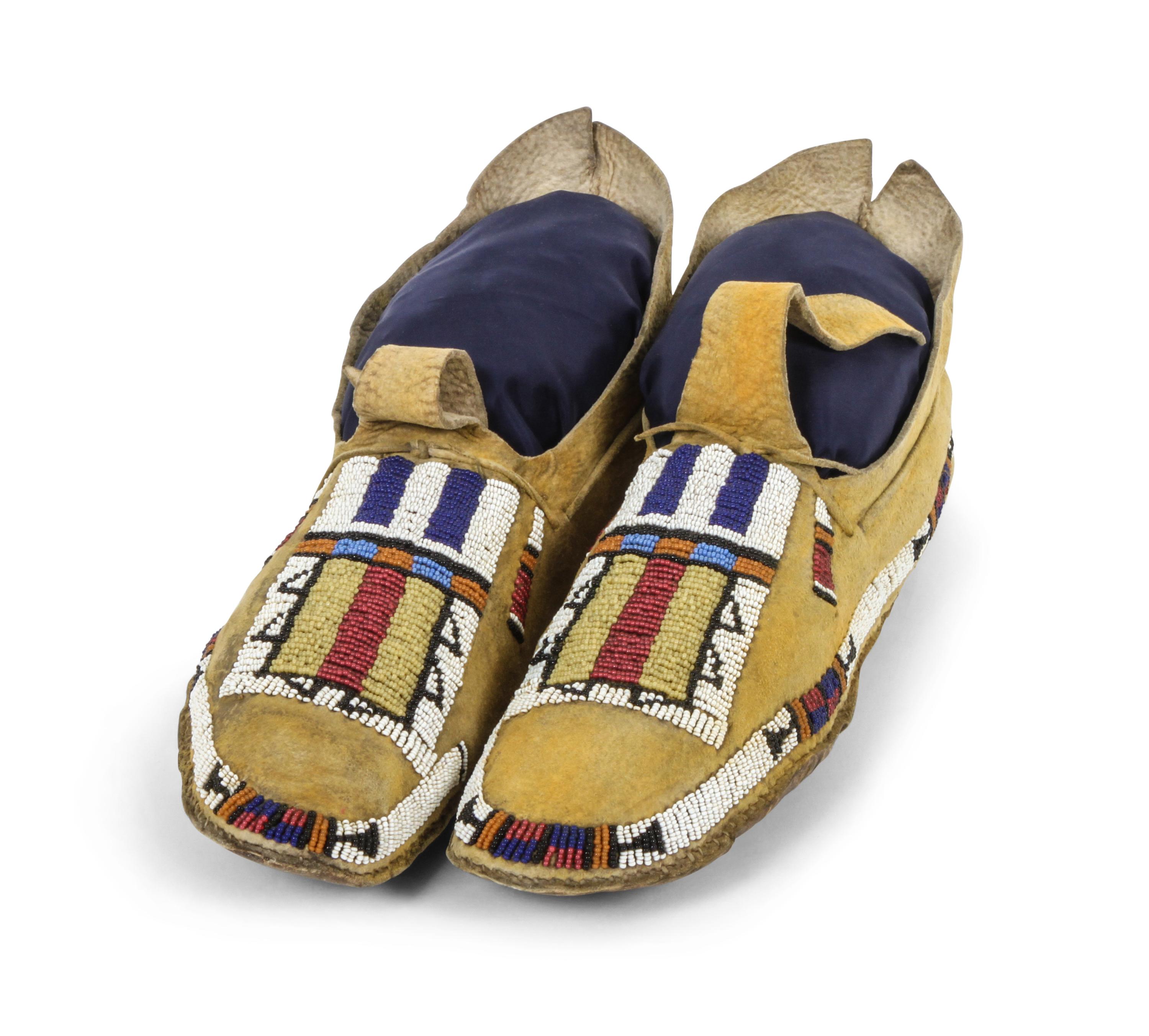 A Pair of Hide and Beaded Arapahoe Moccasins Length 9 1/2 inches. — LATE 19TH CENTURY