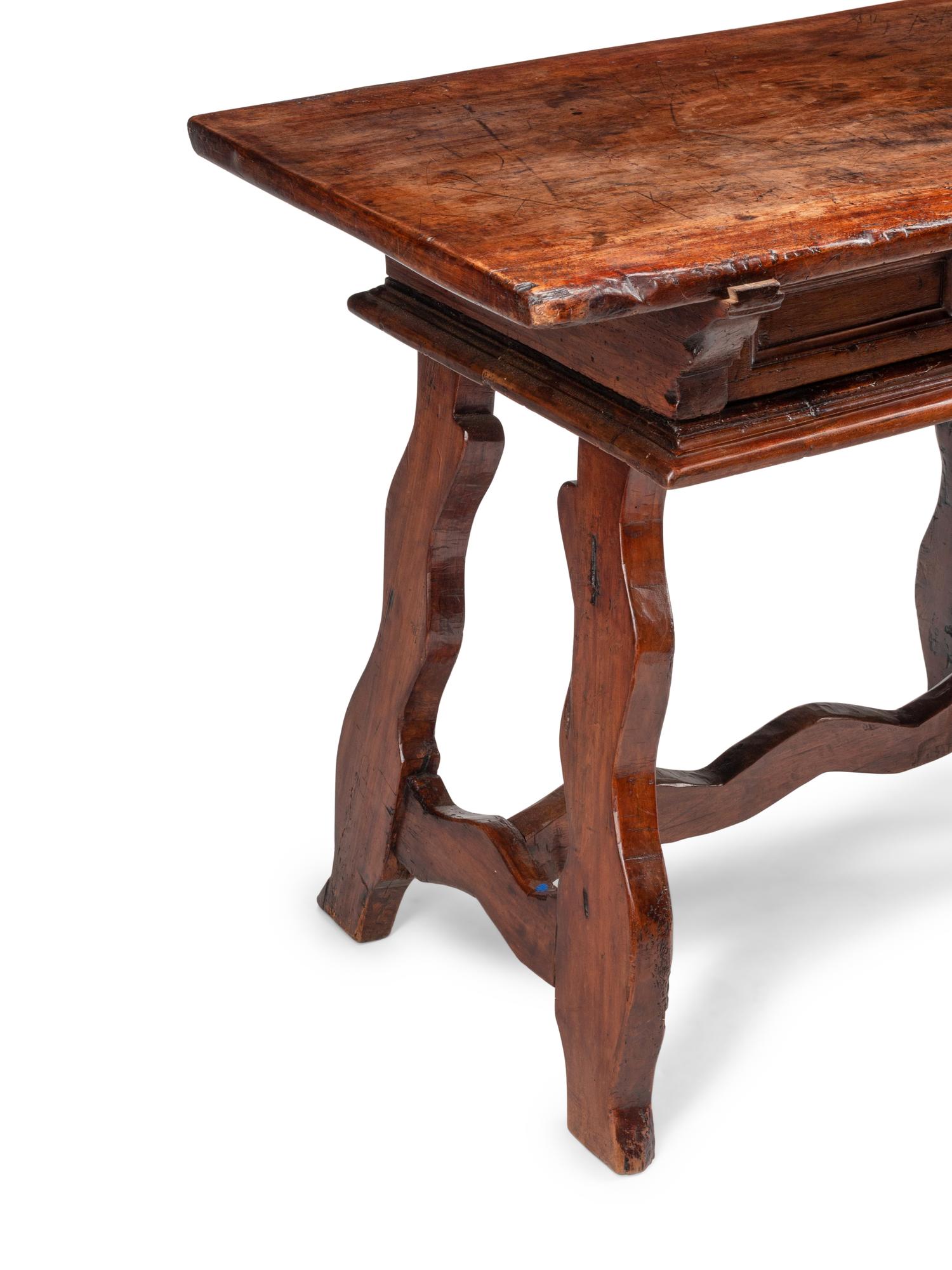 An Italian Baroque Walnut Trestle Table
