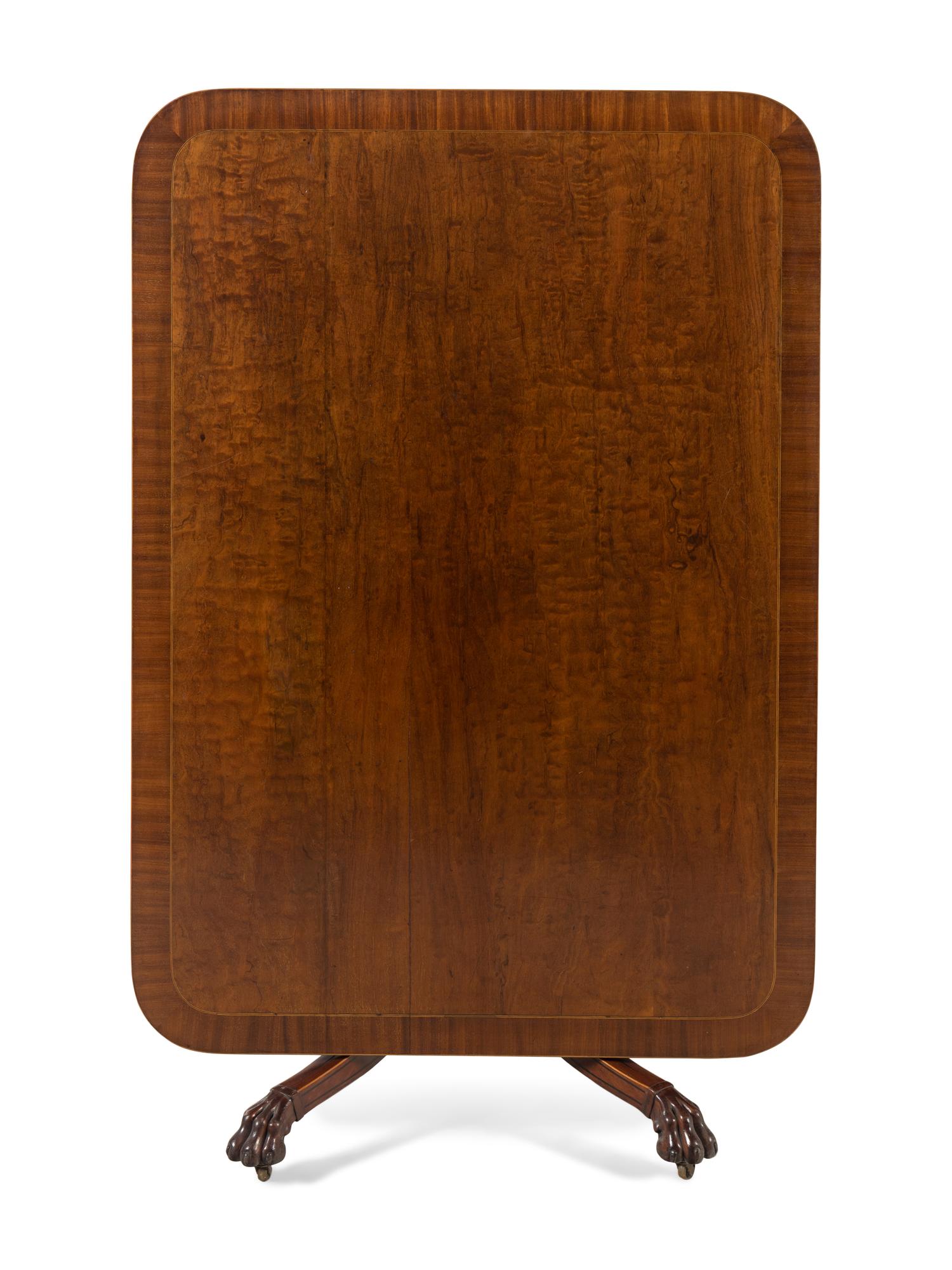 A Regency Part Ebonized Mahogany Brass-Inlaid Breakfast Table